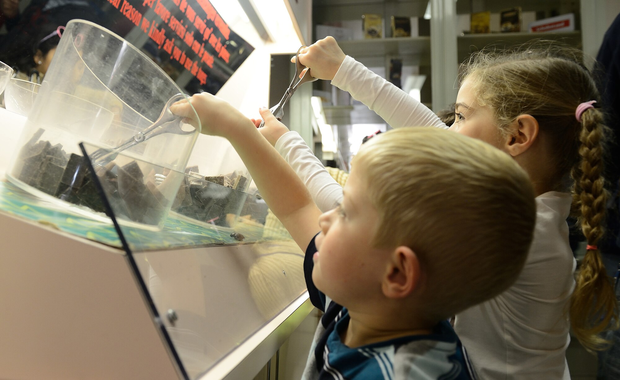 Children help themselves to chocolate samples at Alprose Chocolate Factory, Oct. 18, 2014, in Lugano, Switzerland. Since 1957, the factory has produced Swiss chocolate enjoyed in 35 countries around the world. (U.S. Air Force photo/Staff Sgt. R.J. Biermann)