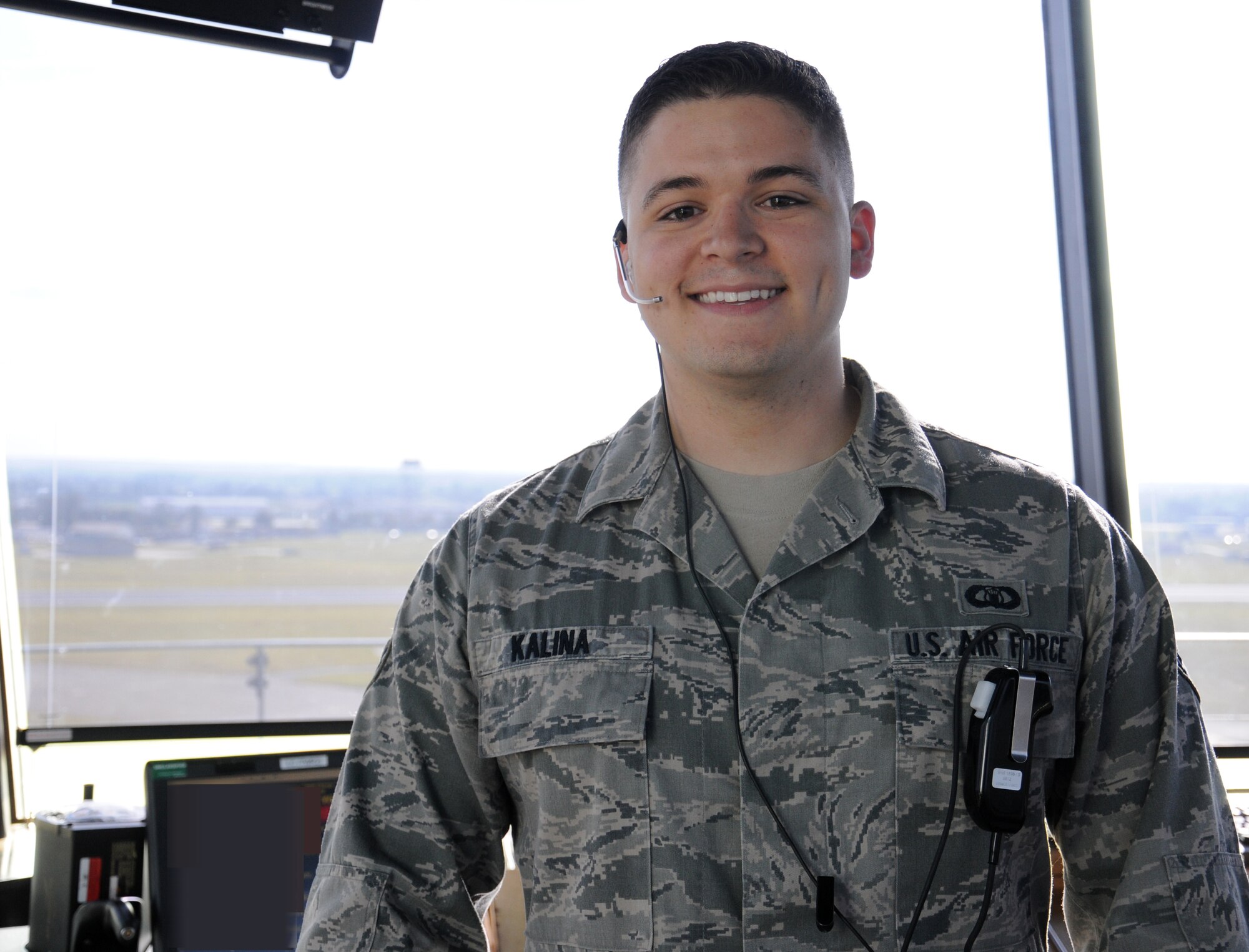 U.S. Air Force Senior Airman Andrew Kalina, 100th Operations Support Squadron Air Traffic Controller from Hoffman Estates, Ill., poses for a photograph Oct. 3, 2014, on RAF Mildenhall, England. Kalina joined the Air Force to serve his country and continue a long family history of military service. His family has been serving in the military since before World War I. (U.S. Air Force photo/Gina Randall/Released)