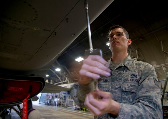 Staff Sgt. Kevin Amberson, 35th Aircraft Maintenance Squadron avionics technician attached to the 14th Aircraft Maintenance Unit, secures a panel on an F-16 Fighting Falcon at Misawa Air Base, Japan, Oct. 22, 2014. As an avionics NCO, Amberson is responsible for teaching his subordinates how to fix over 20 different systems on the F-16 Fighting Falcon. His outstanding work ethic and overall good conduct and discipline earned him the title of Wild Weasel of the Week.  (U.S. Air Force photo by Staff Sgt. Alyssa C. Wallace)