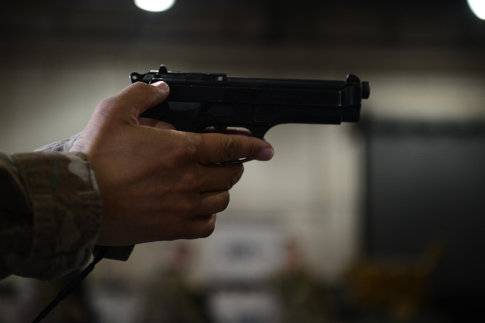 A U.S. Air Force Airman participates in weapon drills during Check Six program training at Bagram Airfield, Afghanistan Oct. 21, 2014.  The Check Six program helps prepare Airmen to deter, detect and defeat insider threats by increasing their awareness and vigilance through initial and recurring training.  (U.S. Air Force photo by Staff Sgt. Evelyn Chavez/Released)