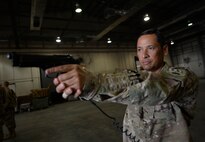 A U.S. Air Force Senior Master Sgt. Miguel Rodriguez, 455th Expeditionary Aerial Port Squadron operations superintendent,  participates in weapon drills during Check Six program training at Bagram Airfield, Afghanistan Oct. 21, 2014.  The Check Six program helps prepare Airmen to deter, detect and defeat insider threats by increasing their awareness and vigilance through initial and recurring training. Rodriguez is deployed from Scott Air Force Base, Ill. and a native of Caguas Puerto Rico.  (U.S. Air Force photo by Staff Sgt. Evelyn Chavez/Released) 
