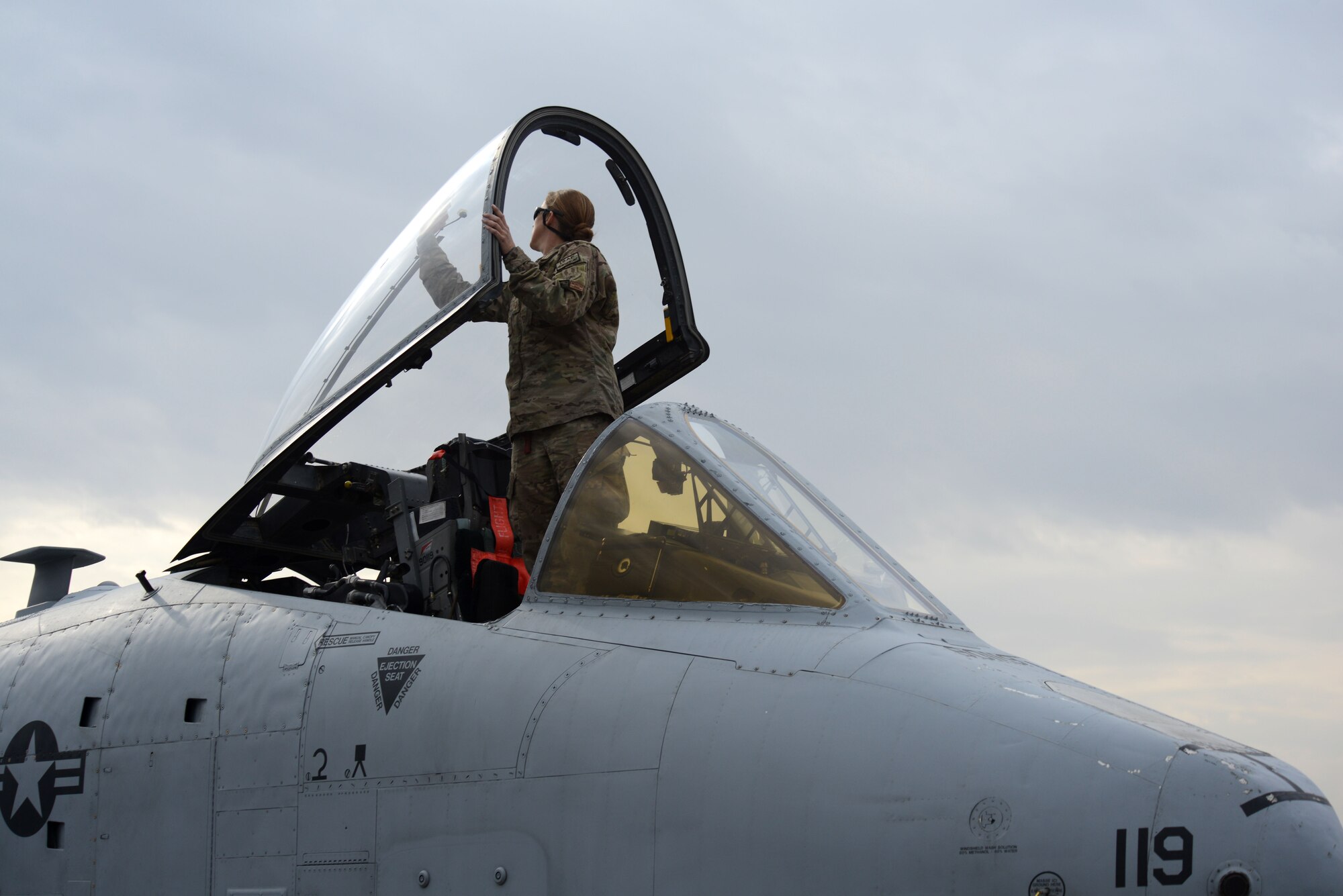 BAGRAM AIRFIELD, Afghanistan -  U.S. Air Force Staff Sgt. Jessica Womrath, a crew chief assigned to the 455th Expeditionary Maintenance Squadron, cleans the cockpit glass of an A-10 Thunderbolt II Oct. 19, 2014 at Bagram Airfield, Afghanistan. Womrath, a native of Kansas City, Mo., is responsible for ensuring the aircraft is mission ready and able to perform close air support missions throughout Afghanistan. Womrath is deployed form the 442nd Fighter Wing at Whiteman Air Force Base, Mo. (U.S. Air Force photo by Master Sgt. Cohen A. Young/Released)
