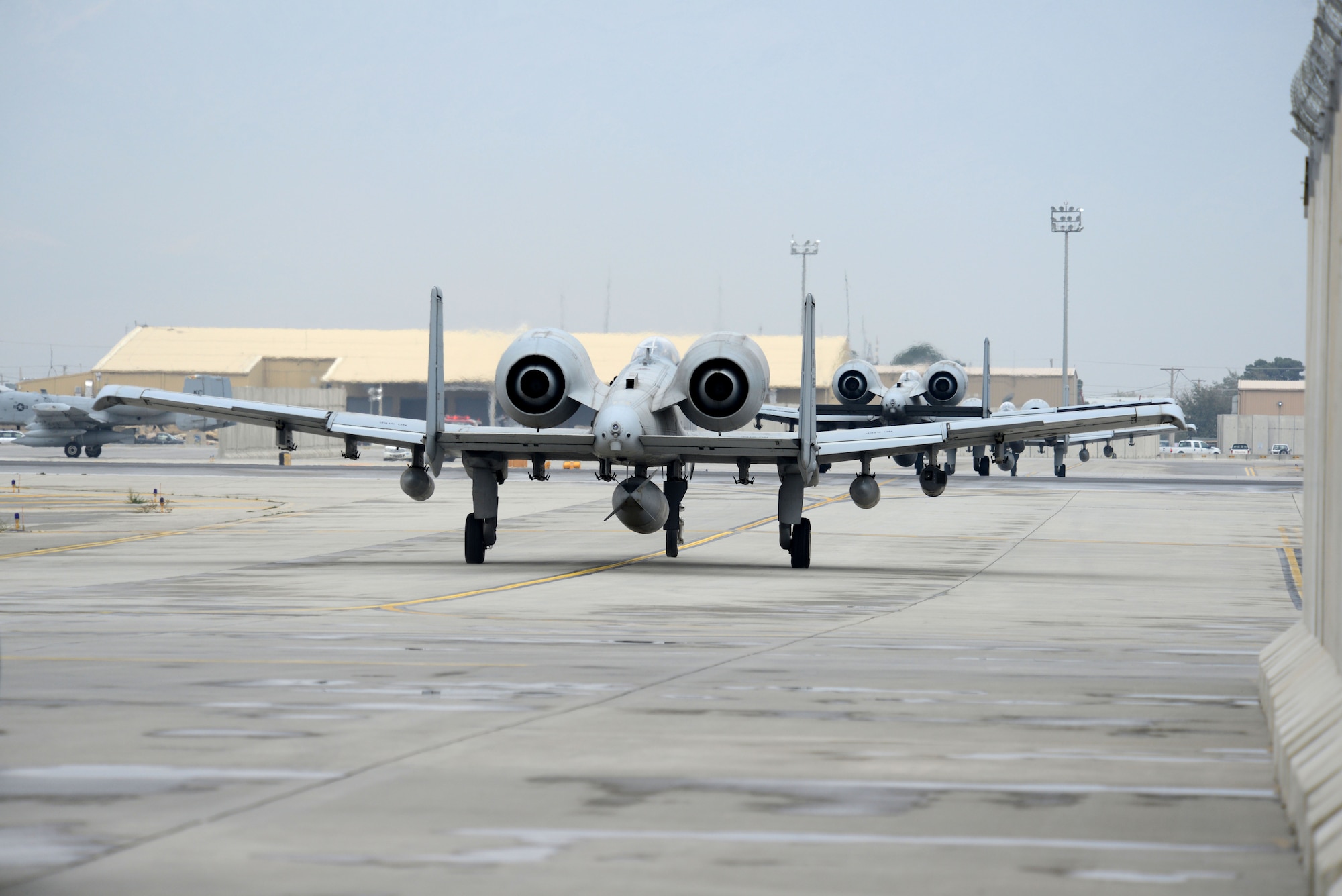 BAGRAM AIRFIELD, Afghanistan -  A-10 Thunderbolt II aircraft, assigned to the 303rd Expeditionary Fighter Squadron, taxi onto the runway Oct. 19, 2014 prior to departing Bagram Airfield, Afghanistan. The 303 EFS was responsible for close air support operations throughout Afghanistan and was deployed from the 442nd Fighter Wing at Whiteman Air Force Base, Mo. The 303 EFS was succeeded by the 163rd Expeditionary Fighter Squadron.   (U.S. Air Force photo by Master Sgt. Cohen A. Young/Released)