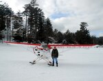 Lt. Col. Mark Doll is pictured here with his personally-owned ski-plane, a 1946 Aeronca Champ on skis, in Sacandaga Resevoir, N.Y. Doll is the Air National Guard liaison to the National Science Foundation and an LC-130 ski-plane pilot with the 109th Airlift Wing of the New York Air National Guard.