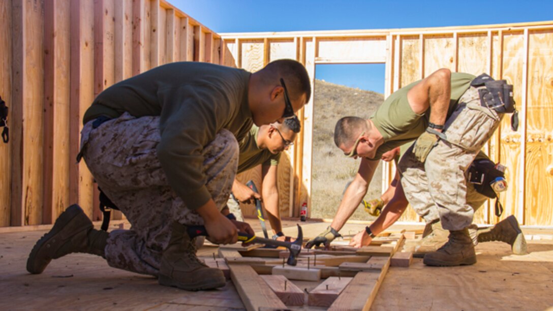 Marines with Marine Wing Support Squadron 373, Combat Engineer Platoon, erect a multipurpose building during exercise Pacific Horizon 2015 aboard Marine Corps Base Camp Pendleton, Calif., Oct. 21. The SWA hut would serve as shelter, billeting or medical facility in a humanitarian aid or disaster relief mission. PH 15 is a scenario driven, simulation supported crisis response exercise designed to improve 1st Marine Expeditionary Brigade's and Expeditionary Strike Group 3's interoperability and strengthen Navy-Marine Corps relations by conducting an in-stream Maritime Prepositioning Force offload of equipment by providing host country civil-military security assistance, and by conducting infrastructure restoration support from Oct. 20-28.  (U.S. Marine Corps photo by Cpl. Rick Hurtado / Released)