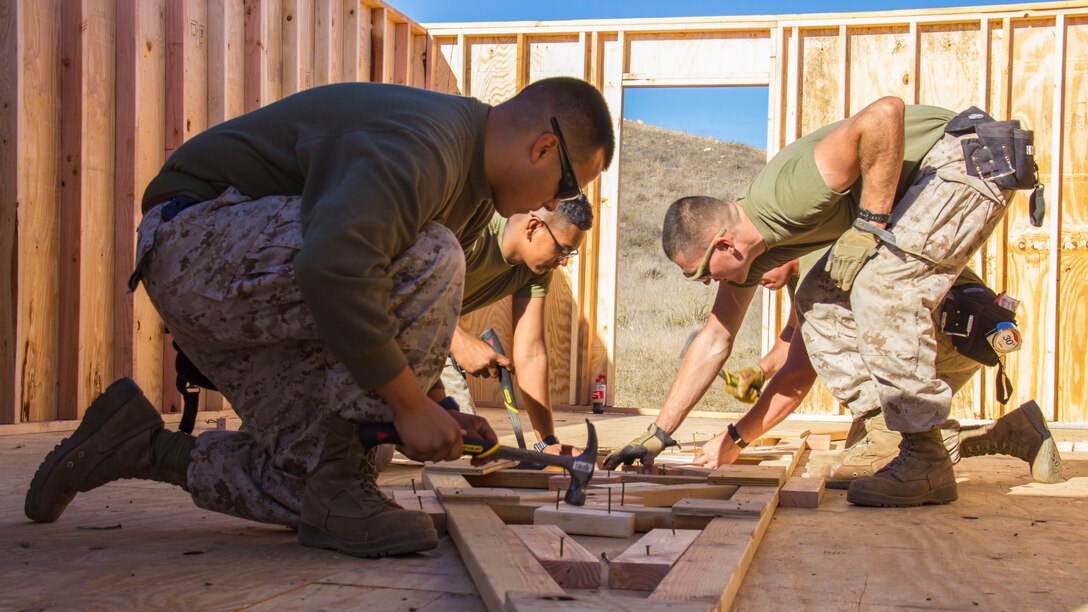 Marines with Marine Wing Support Squadron 373, Combat Engineer Platoon, erect a multipurpose building (SWA hut) during exercise Pacific Horizon 2015 aboard Marine Corps Base Camp Pendleton, Calif., Oct. 21. The SWA hut would serve as shelter, billeting or medical facility in a humanitarian aid or disaster relief mission. PH 15 is a scenario driven, simulation supported crisis response exercise designed to improve 1st Marine Expeditionary Brigade's and Expeditionary Strike Group 3's interoperability and strengthen Navy-Marine Corps relations by conducting an in-stream Maritime Prepositioning Force offload of equipment by providing host country civil-military security assistance, and by conducting infrastructure restoration support from Oct. 20-28.  