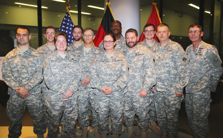 The Forward Engineering Support Team-Advanced, deploying to Liberia in support of Operation United Assistance, is honored with a departure ceremony at U.S. Army Corps of Engineers Europe District headquarters in Wiesbaden, Germany Oct. 20, 2014. The 13-member team of military and civilian technical experts — from electrical and environmental engineers, to real estate and power generation specialists — will support the construction of Ebola Treatment Units as part of the operation. The ETUs will be constructed at site locations chosen by the Government of Liberia Ministry of Health and the Armed Forces of Liberia to assist in the containment of Ebola. Additionally, USACE military and civilian personnel will assist with the construction, planning, surveying, and design of life-support and logistics facilities in Senegal and Liberia. U.S. Agency for International Development is the lead U.S. Government organization for the operation and U.S. Africa Command is supporting the effort by providing command and control, logistics, training and engineering assets — including the FEST-A — to contain the Ebola virus outbreak in West African nations. 