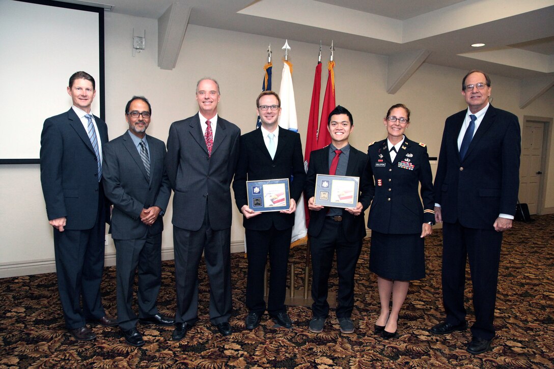 The Los Angeles District participants of the U.S. Army Corps of Engineers South Pacific Division fiscal year 2014 Regional Leadership Development Program, Jacob Hensel and Rueben Saski gather for a photo with their district leaders after the graduation ceremony at Fort MacArthur Oct. 21.