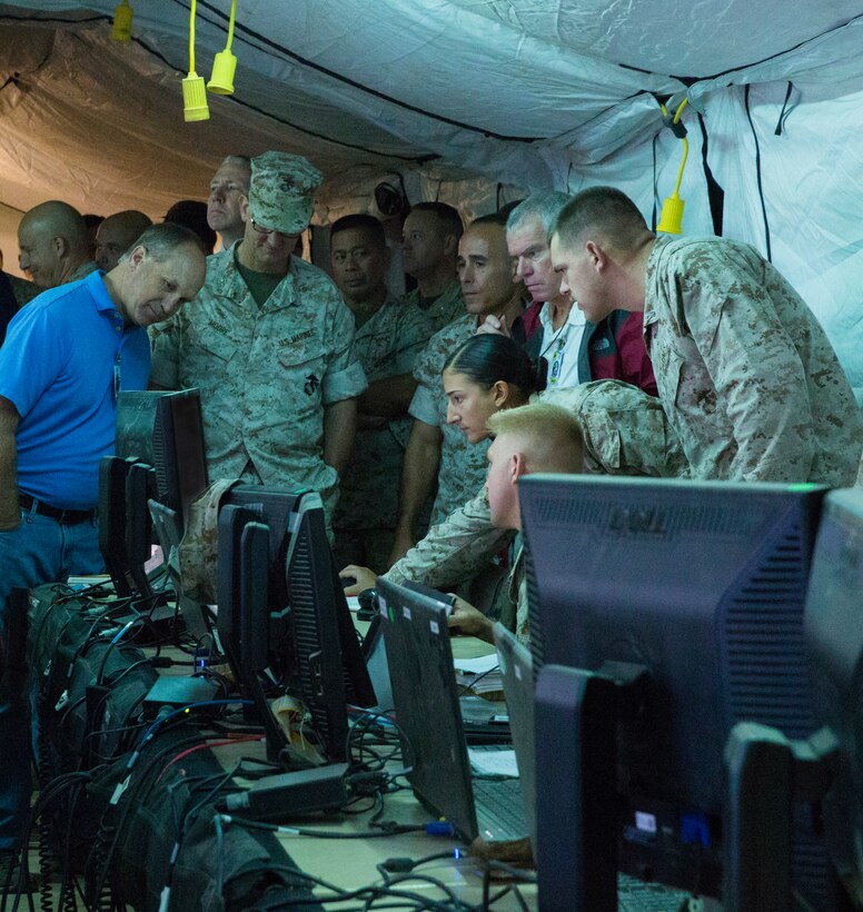 Visiting VIPs observe the Common Aviation Command Control System (CAC2S) Phase II in action on the digital front at the Stoval Auxiliary Airfield, on Marine Corps Air Station Yuma, Ariz., Oct. 8. The CAC2S system is slated to replace various unique current aviation command and control systems in order to increase unit interoperability and maximize future asset potential.