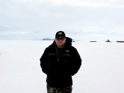 Staff Sgt. Michael Warn stands at the Ross Sea Iceshelf in Antarctica. Warn is an electrical and environmental specialist on C/LC-130H aircraft and is a member of the New York Air National Guard's 109th Airlift Wing.