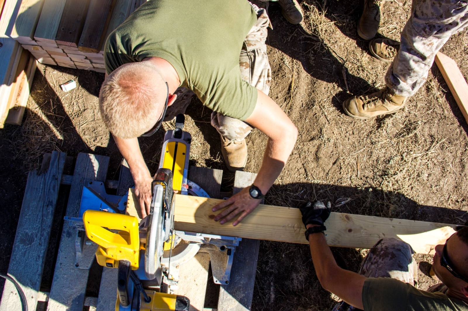 Private First Class Jeffry Brunning, 19, a combat engineer with Marine Wing Support Squadron 373, Combat Engineer Platoon, from Spring Lake, N.C., cuts a piece of a 4-inch by 2-inch wooden board to erect a multipurpose building (SWA hut) during exercise Pacific Horizon 2015 aboard Marine Corps Base Camp Pendleton, Calif., Oct. 21. The SWA hut would serve as shelter, billeting or medical facility in a humanitarian aid or disaster relief mission. PH 15 is a scenario driven, simulation supported crisis response exercise designed to improve 1st Marine Expeditionary Brigade's and Expeditionary Strike Group 3's interoperability and strengthen Navy-Marine Corps relations by conducting an in-stream Maritime Prepositioning Force offload of equipment by providing host country civil-military security assistance, and by conducting infrastructure restoration support from Oct. 20-28. (U.S. Marine Corps photo by Cpl. Rick Hurtado / Released)