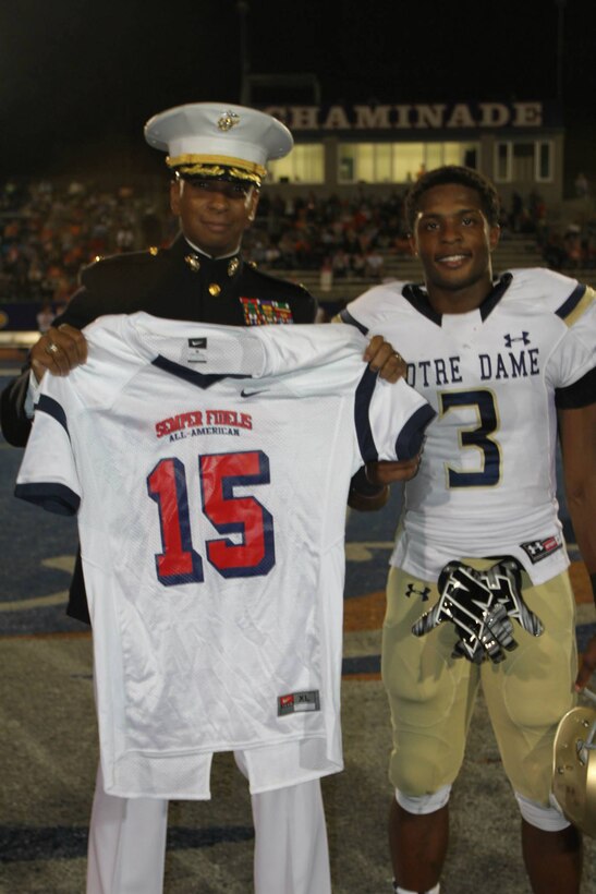 Maj. Dominique B. Neal, commanding officer of Recruiting Station Los
Angeles, presents CJ Sanders with the 2015 Semper Fidelis All-American Bowl
jersey, Oct. 10, 2014. Sanders is a senior at Notre Dame High School in Van Nuys, Calif. and was chosen from student athletes across the nation to
represent Team West during the 4th annual Semper Fi Bowl, which will be held at the Stub Hub Center in Carson, Calif. on Jan. 4, 2015. Sanders is not
only an outstanding wide receiver for his team, but also maintains a high
GPA and shows leadership characteristics amongst teachers and peers.