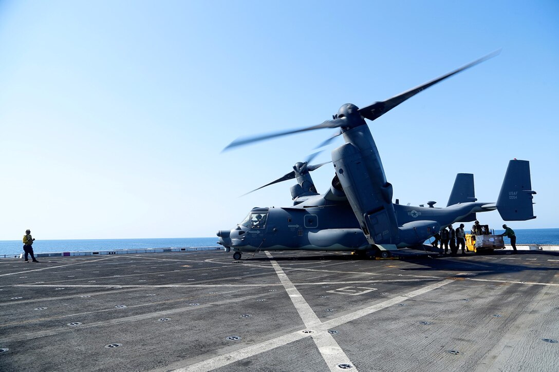 Marines and Sailors aboard the amphibious transport dock ship USS San Diego (LPD 22) offload supply pallets from a U.S. Air Force CV-22B Osprey from the 20th Expeditionary Special Operations Squadron (ESOS).  San Diego is part of the Makin Island Amphibious Ready Group and, with the embarked 11th Marine Expeditionary Unit, is deployed in support of maritime and theater security operations in the U.S. 5th Fleet area of responsibility.  (U.S. Marine Corps photo by Gunnery Sgt. Rome M. Lazarus/ Released)  