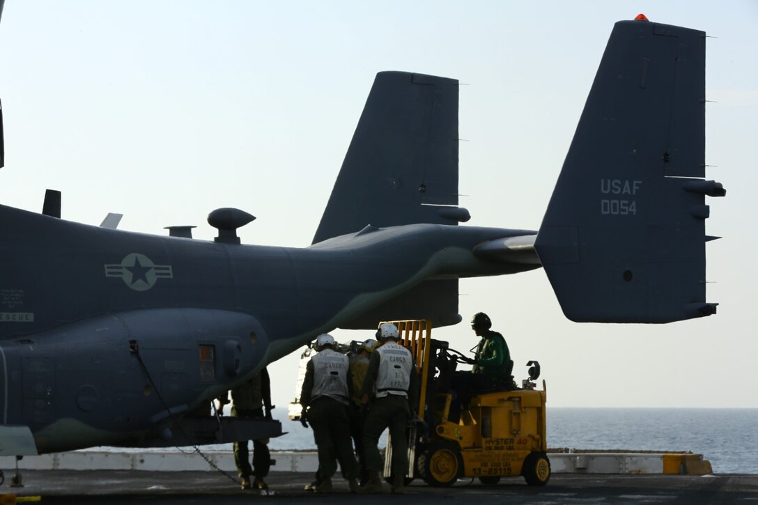 Marines and Sailors aboard the amphibious transport dock ship USS San Diego (LPD 22) unload food and supplies from a U.S. Air Force CV-22B Osprey with the 20th Expeditionary Special Operations Squadron (ESOS). Marines from the 11th Marine Expeditionary Unit (MEU) are deployed with the Makin Island Amphibious Ready Group as a flexible, adaptable and persistent force in the U.S. 5th Fleet area of responsibility. (U.S. Marine Corps photo by Cpl. Jonathan R. Waldman/Released)