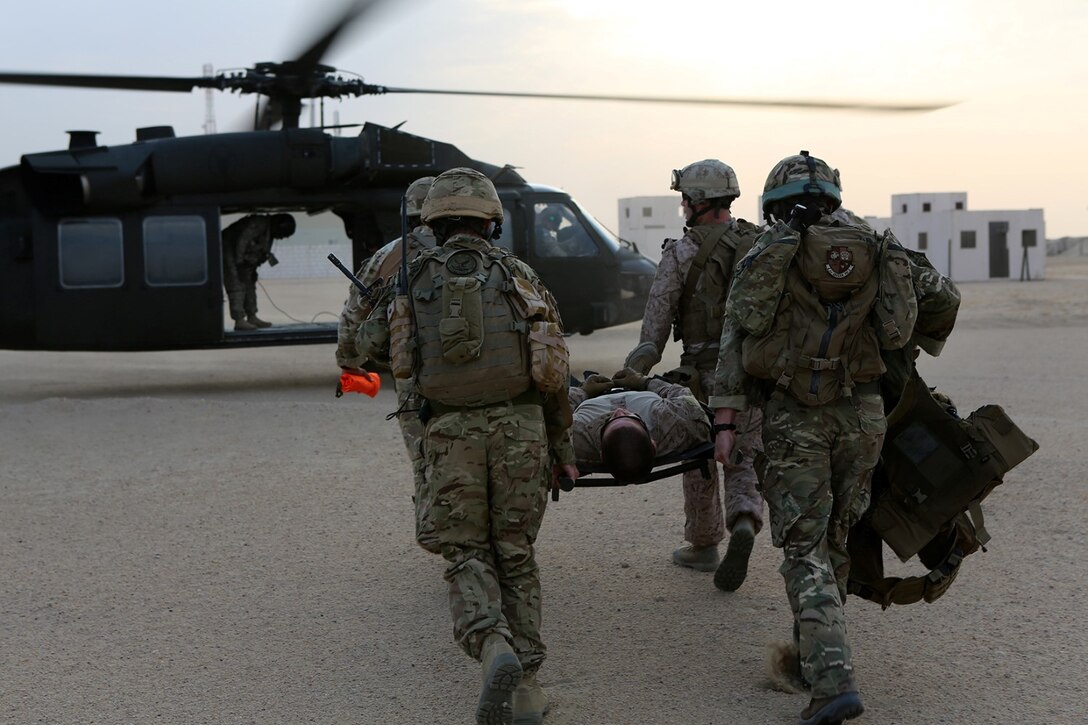 U.S. Marines with 1st Air Naval Gunfire Liaison Company (ANGLICO), 11th Marine Expeditionary Unit (MEU), and British Royal Marine Commandos participate in a multi-national, joint-service casualty evacuation sustainment training evolution. The 11th MEU is deployed with the Makin Island Amphibious Ready Group as a theater reserve and crisis response force throughout U.S. Central Command and the U.S. 5th Fleet area of responsibility. (U.S. Marine Corps photo by Sgt. Melissa Wenger/Released)