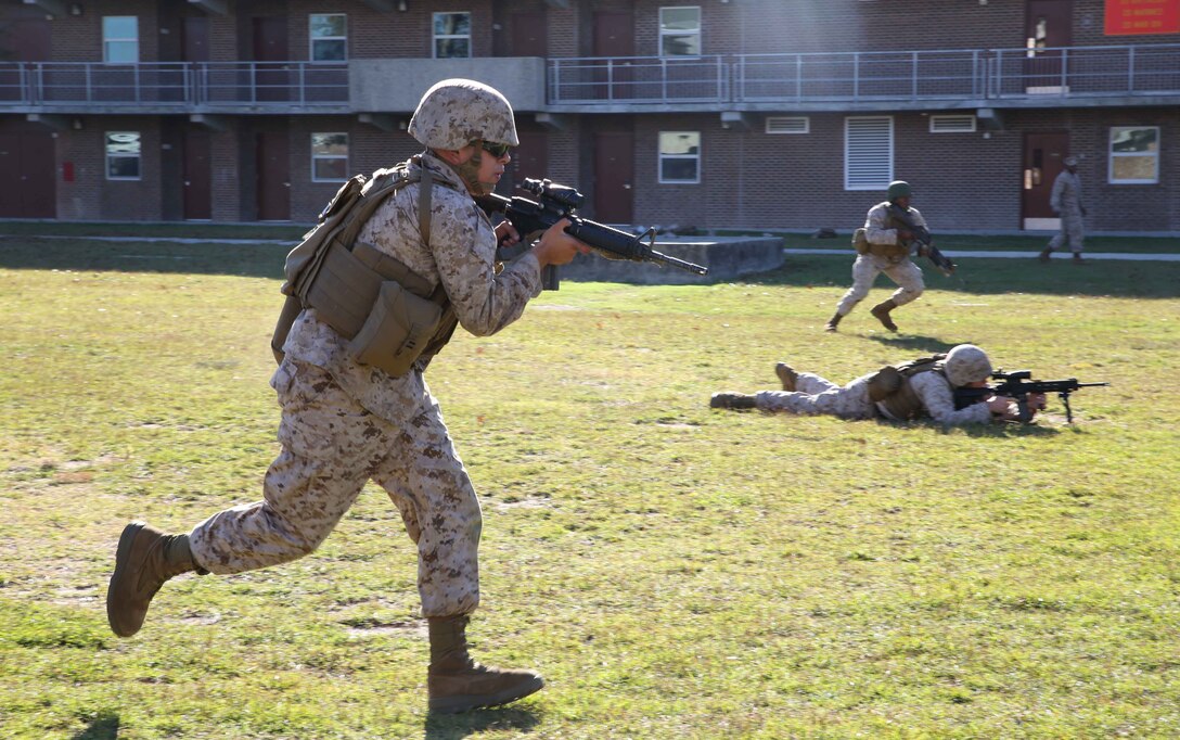 Lance Cpl. Emmanuel Coria, administrative specialist, Provisional Rifle Platoon, Company A, Ground Combat Element Integrated Task Force, conducts a squad movement during fire and maneuver drills executed at the company’s barracks, Oct. 22, 2014. The Co. A PRP is made up of male and female volunteers from numerous military occupational specialties who have had no additional infantry-specific training since Marine Combat Training. From October 2014 to July 2015, the Ground Combat Element Integrated Task Force will conduct individual and collective skills training in designated combat arms occupational specialties in order to facilitate the standards based assessment of the physical performance of Marines in a simulated operating environment performing specific ground combat arms tasks. (U.S. Marine Corps photo by Cpl. Paul S. Martinez/Released)