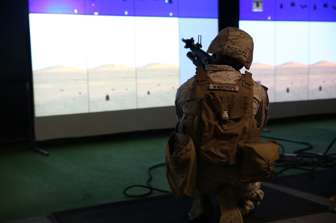 Lance Cpl. Chavon Wauchope, administrative specialist, Provisional Rifle Platoon, Company A, Ground Combat Element Integrated Task Force, practices combat marksmanship at the indoor simulated marksmanship trainer aboard Marine Corps Base Camp Lejeune, North Carolina,, Oct. 22, 2014. The Marines were utilizing the M16A4 service rifle, M4 carbine rifle and M203 grenade launcher. The Co. A PRP is made up of male and female volunteers from numerous military occupational specialties who have had no additional infantry-specific training since Marine Combat Training. From October 2014 to July 2015, the Ground Combat Element Integrated Task Force will conduct individual and collective skills training in designated combat arms occupational specialties in order to facilitate the standards based assessment of the physical performance of Marines in a simulated operating environment performing specific ground combat arms tasks. (U.S. Marine Corps photo by Cpl. Paul S. Martinez/Released)