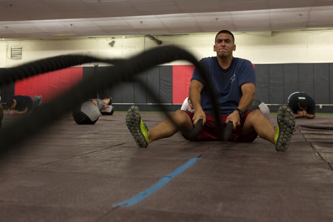 Sgt. Jeremy Pillai, an aircraft recovery specialist with Headquarters and Headquarters Squadron (H&HS), exercises with a battle rope during a workout at the High Intensity Tactical Training Center aboard Marine Corps Air Station Miramar, Calif., Oct. 22. The Aircraft Recovery Marines began taking part in the program’s workouts earlier in October and continue to go as often as they can.