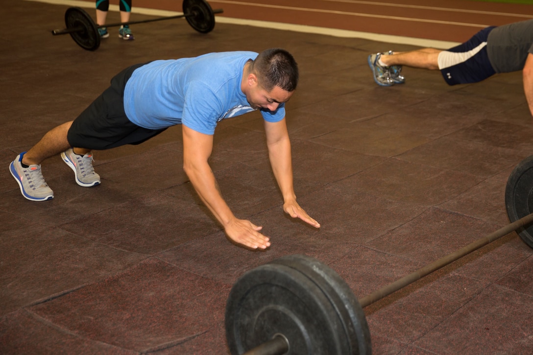 Sgt. Gilbert Camacho, an aircraft recovery specialist with Headquarters and Headquarters Squadron (H&HS), performs plyometric push ups during a workout at the High Intensity Tactical Training Center aboard Marine Corps Air Station Miramar, Calif., Oct. 22. The HITT Program is designed to challenge Marines’ cardiovascular systems while improving agility, speed, power, endurance and strength.