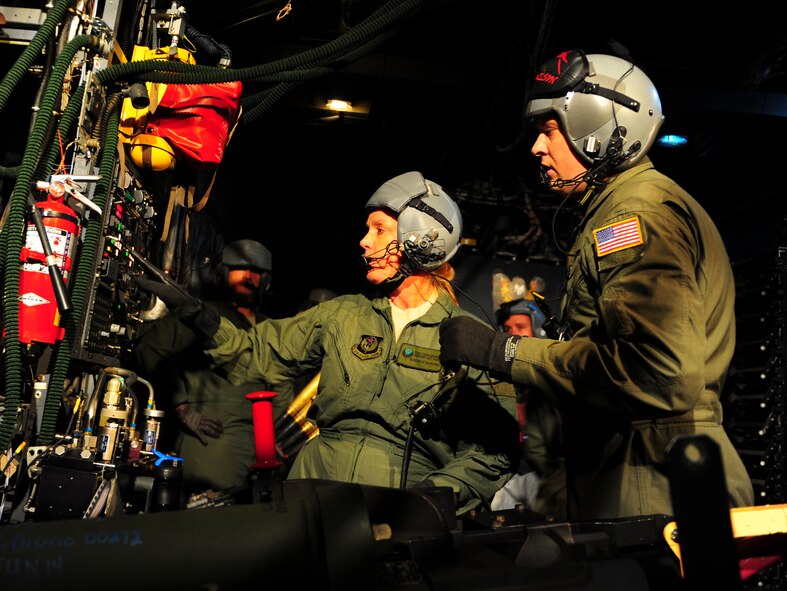 Secretary of the Air Force Deborah Lee James prepares a 105mm cannon on board an AC-130U Gunship, Oct. 20, 2014, at Hurlburt Field, Fla. During her two-day visit to to the base James met with Airmen and got a first-hand look at Air Commando operations. (U.S. Air Force photo/Senior Airman Christopher Callaway)