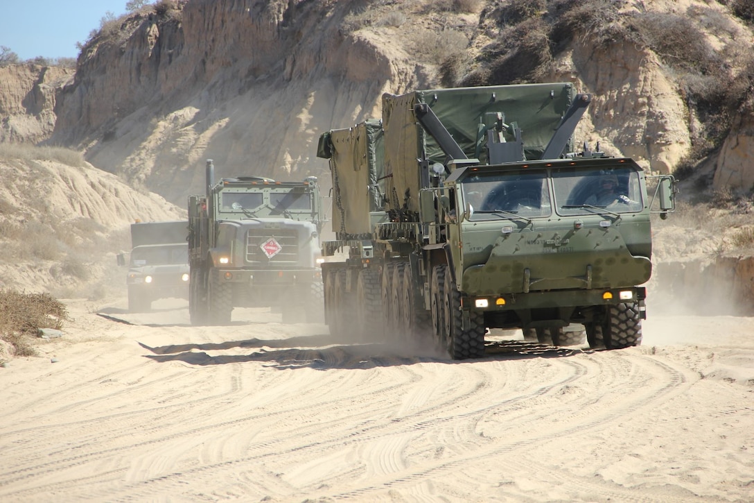 Marines with Marine Wing Support Squadron 373 transport components of the Tactical Water Purification System to the beach at Marine Corps Base Camp Pendleton, Calif., for exercise Pacific Horizon 2015, Oct. 22. PH 15 increases the ability of 1st Marine Expeditionary Brigade and Expeditionary Strike Group 3 to plan, communicate and conduct complex sea and shore based operations in response to natural disasters. 