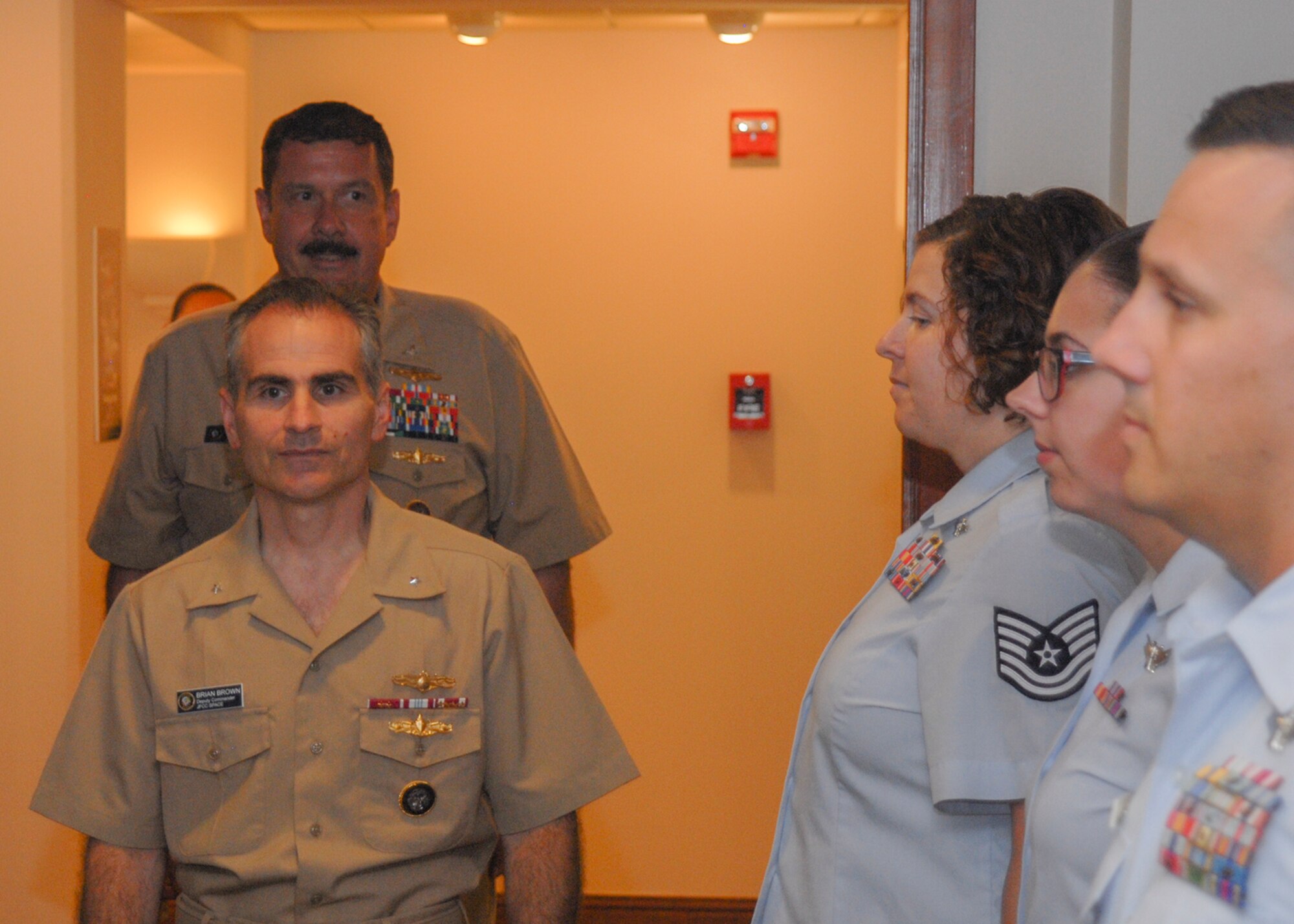 U.S. Navy Rear Adm. Brian Brown, deputy commander, Joint Functional Component Command for Space, and U.S. Navy Capt. Joseph Spegele, chief of staff, JFCC Space, prepare to “come aboard” while flanked by “Side Boys” during JFCC Space’s celebration of the U.S. Navy’s 239th Birthday, Oct. 14, 2014 at Vandenberg Air Force Base, Calif.  Side boys are a part of the quarterdeck ceremonies when an important person or Officer comes on board or leaves a ship. (U.S. Air Force photo by Capt. Nicholas Mercurio/Released)