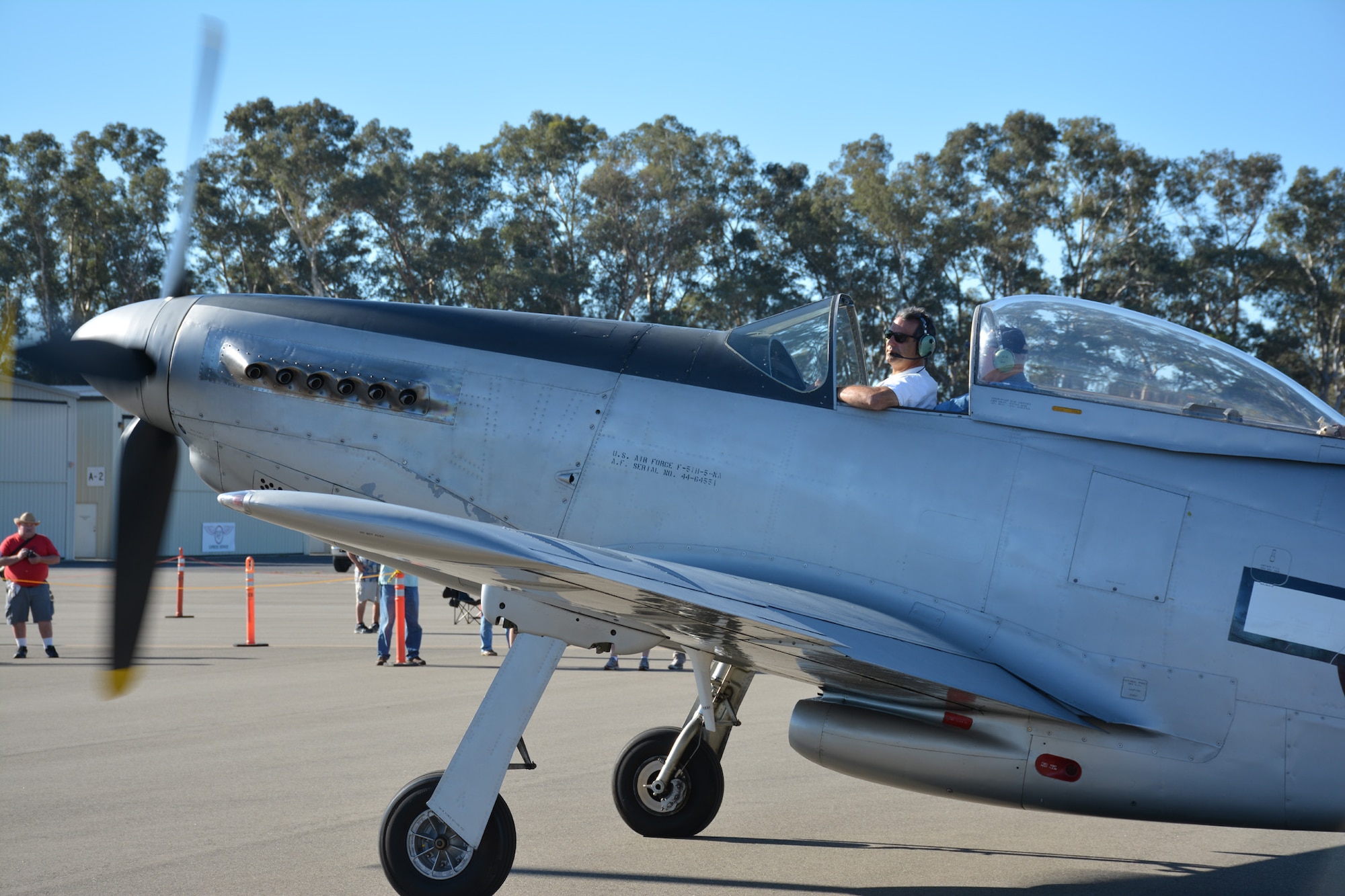 TRAVIS AIR FORCE BASE, Calif. -- The pilot of a vintage World War II-era P-51 Mustang taxis his aircraft to a parking spot Oct. 18, 2014, at the Nut Tree Airport in Vacaville, Calif. Members of the Air Force Reserve's 349th Air Mobility Wing volunteered to support the 9th Annual "Mustangs and More" aircraft and car show at the airport where all of the proceeds from ticket sales went to support the Travis Air Force Base Heritage Center and the maintenance of display aircraft there. This year's event hosted more than 40 vintage aircraft as well as classic and new Ford Mustangs and other muscle cars. (U.S. Air Force photo/2nd Lt. Stephen J. Collier) 