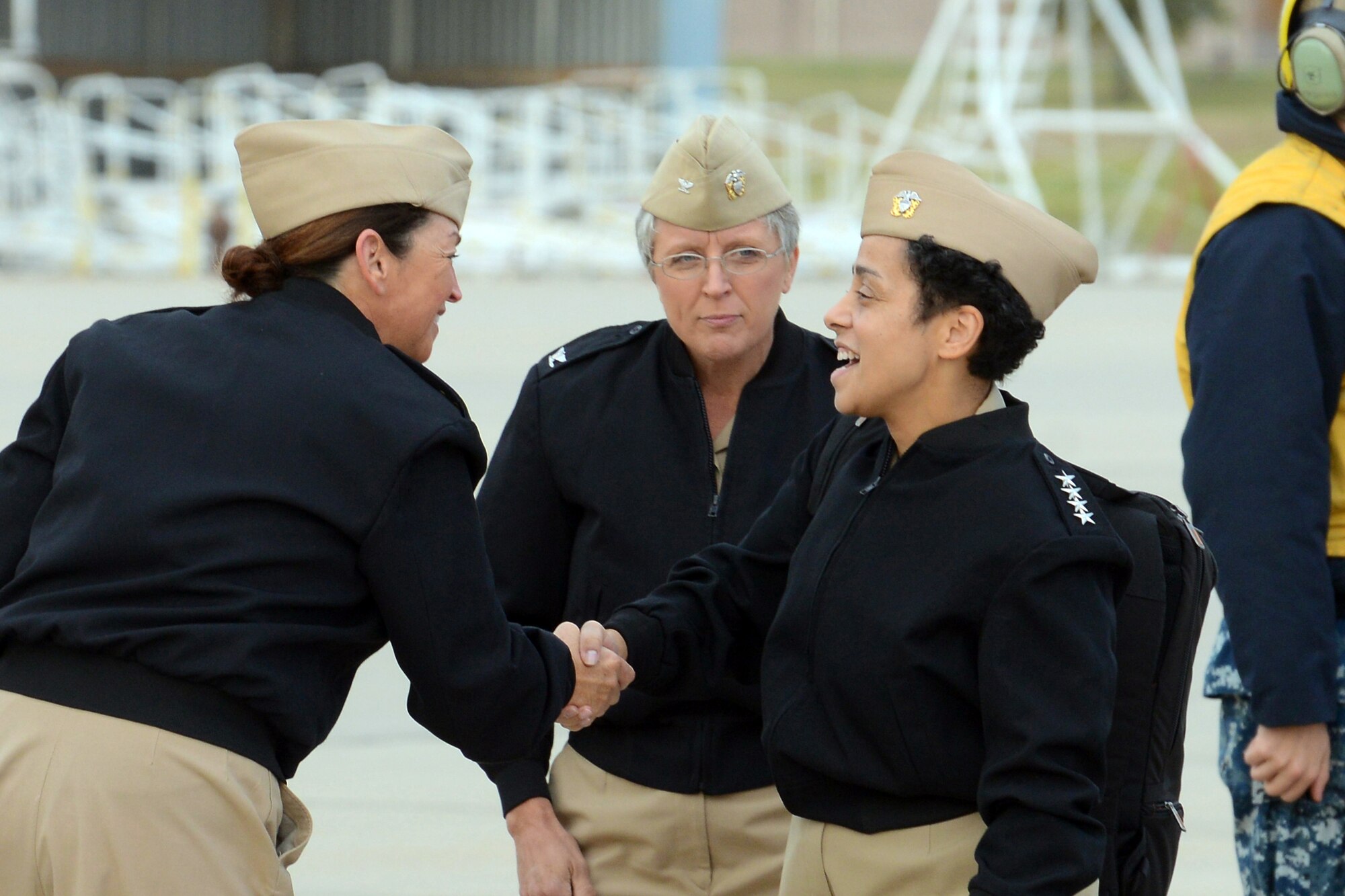 Vice Chief of Naval Operations Adm. Michelle Howard is greeted by Strategic Communications Wing ONE Command Master Chief Cyndi Patterson and Capt. Heather Cole, commodore Strategic Communications Wing ONE and Task Force 124, during a tour of Take Charge And Move Out spaces Oct. 18.  Located at Tinker Air Force Base, TACAMO is responsible to Commander Naval Air Forces for manning, training and equipping the Navy squadrons responsible for nuclear command and control communications to the nation’s nuclear triad mission. (U.S. Navy photo by Chief Petty Officer Chris Delano)

