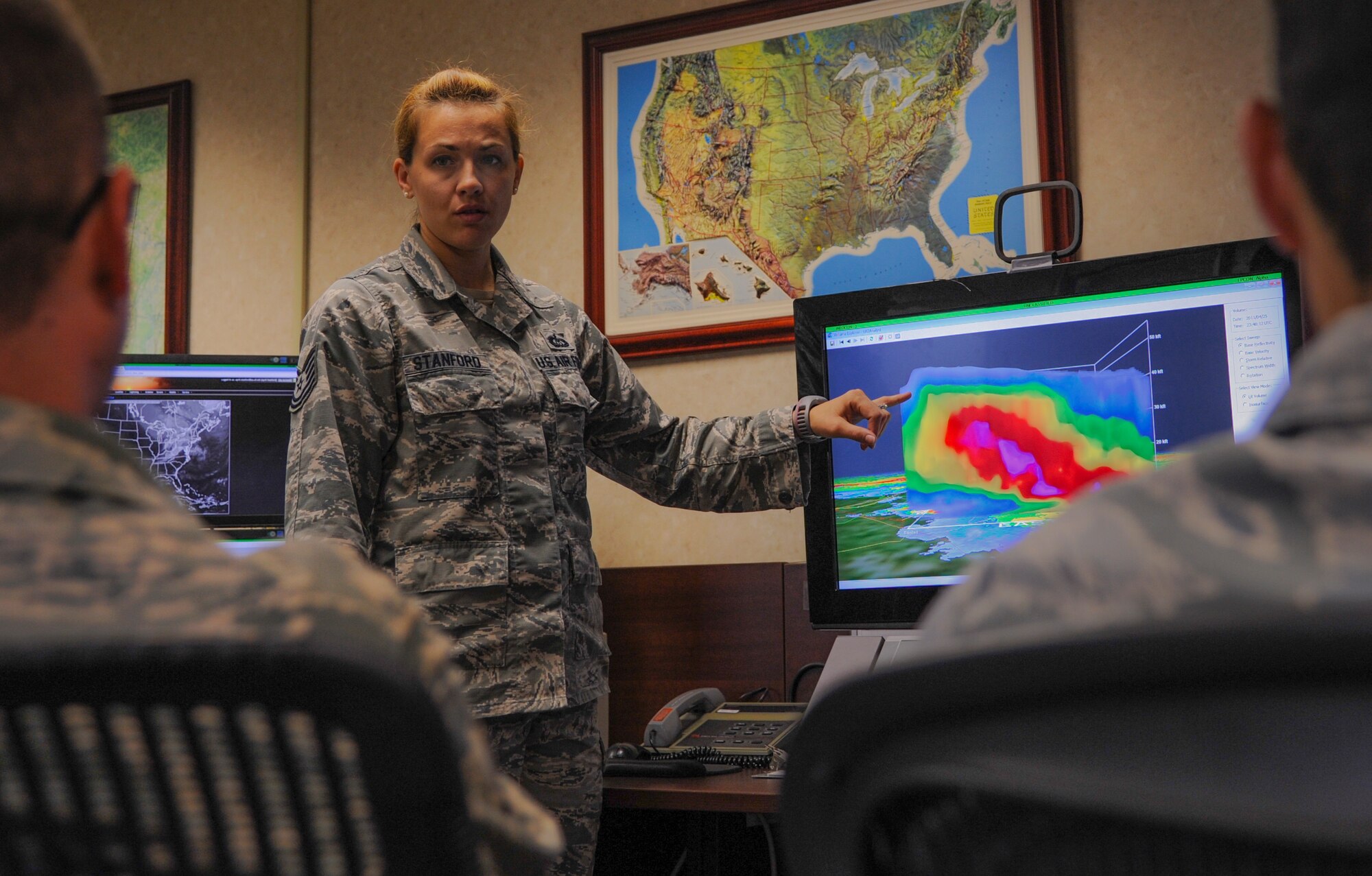 Tech. Sgt. April Stanford, 19th Operations Support Squadron weather flight noncommissioned officer in charge, gives a briefing about severe weather radar visualization Oct. 20, 2014, at Little Rock Air Force Base, Ark. Stanford was selected as the 19th OSS 2013 NCO of the Year and Air Mobility Command’s 2013 Weather Flight NCO of the Year. (U.S. Air Force photo by Airman 1st Class Harry Brexel) 