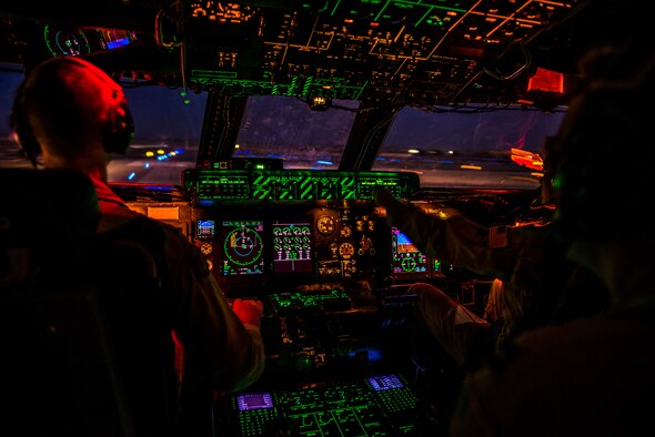 U.S. Air Force Capts. Matthew Upchurch (left) and Jennifer Nolta (right), 9th Airlift Squadron C-5M Super Galaxy pilots, take-off Oct. 6, 2014, from Camp Bastion, Afghanistan. Airmen from the 9th AS transported more than 266,000 pounds of cargo as part of retrograde operations in Afghanistan. Aircrews for the retrograde operations are managed by the 385th Air Expeditionary Group Detachment 1 and this flight surpassed 11 million pounds of cargo transported in a 50-day timespan. During this time frame, crews under the 385th AEG broke Air Mobility Command's operational cargo load record five times. The heaviest load to date is 280,880 pounds. (U.S. Air Force photo by Staff Sgt. Jeremy Bowcock)