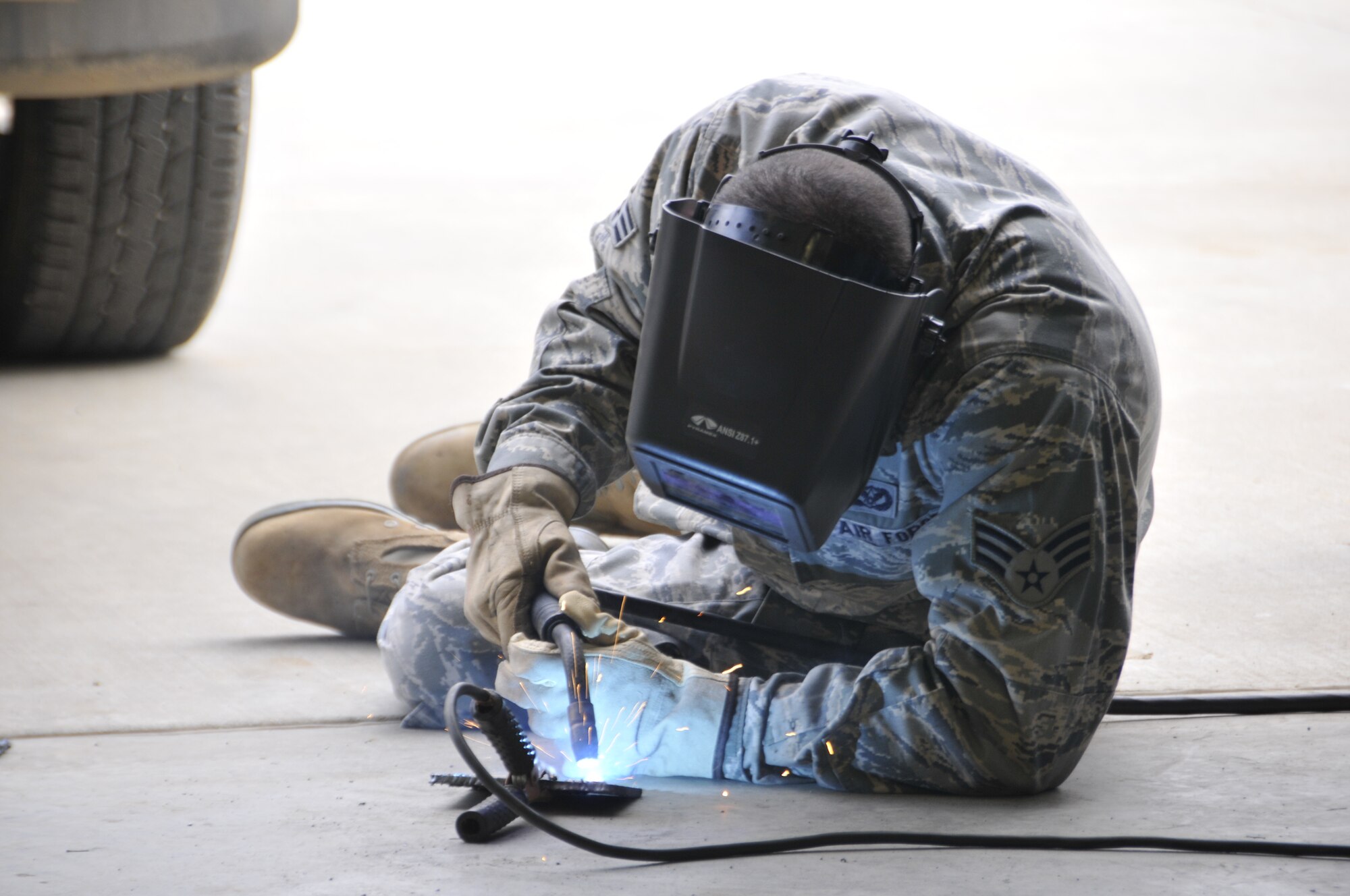 Senior Airman Angelina Duncan of the 210th Rapid Engineer Deployable Heavy Operational Repair Squadron Engineer (REDHORSE) Squadron, New Mexico Air National Guard welds during a course held at Ebbing Air National Guard Base, Fort Smith, Ark., on Sept. 17, 2014. Six Airmen from the 210th were trained by the 188th Civil Engineering Squadron led by Tech. Sgt. Bryan Sutton, 188th REDHORSE welding instructor. (U.S. Air National Guard photo by Tech. Sgt. Josh Lewis/Released)