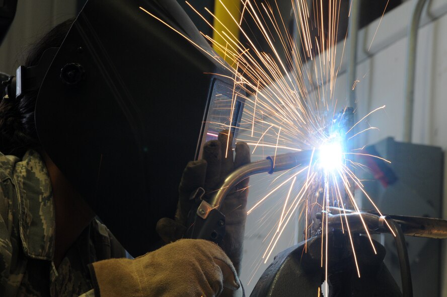 Senior Airman Sarah Greer of the 210th Rapid Engineer Deployable Heavy Operational Repair Squadron Engineer (REDHORSE) Squadron, New Mexico Air National Guard, participates in a welding class held at Ebbing Air National Guard Base, Fort Smith, Ark., Sept. 17, 2014. Six Airmen from the 210th were trained by the 188th Civil Engineering Squadron REDHORSE members led by Tech. Sgt. Bryan Sutton, 188th CES welding instructor. (U.S. Air National Guard photo by Airman 1st Class Cody Martin/Released))