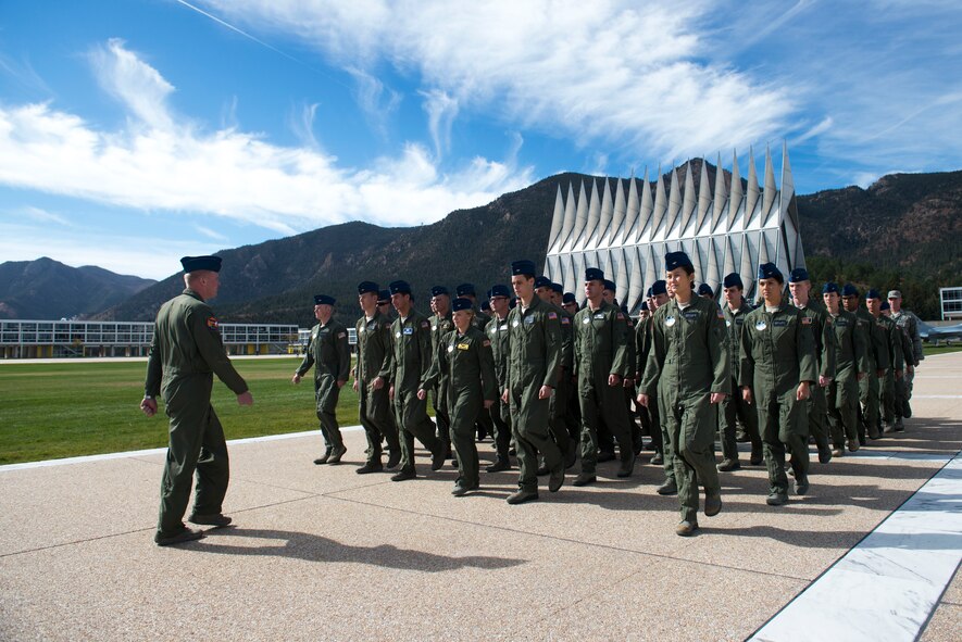 Cadets from Cadet Squadron 9(CS-09) march to Mitchell Hall during a noon meal formation Oct. 17, 2014, at the U.S. Air Force Academy, Colo. Moody Airmen had the opportunity to tour the academy with cadets from CS-09. (U.S. Air Force photo by Airman 1st Class Dillian Bamman/Released)