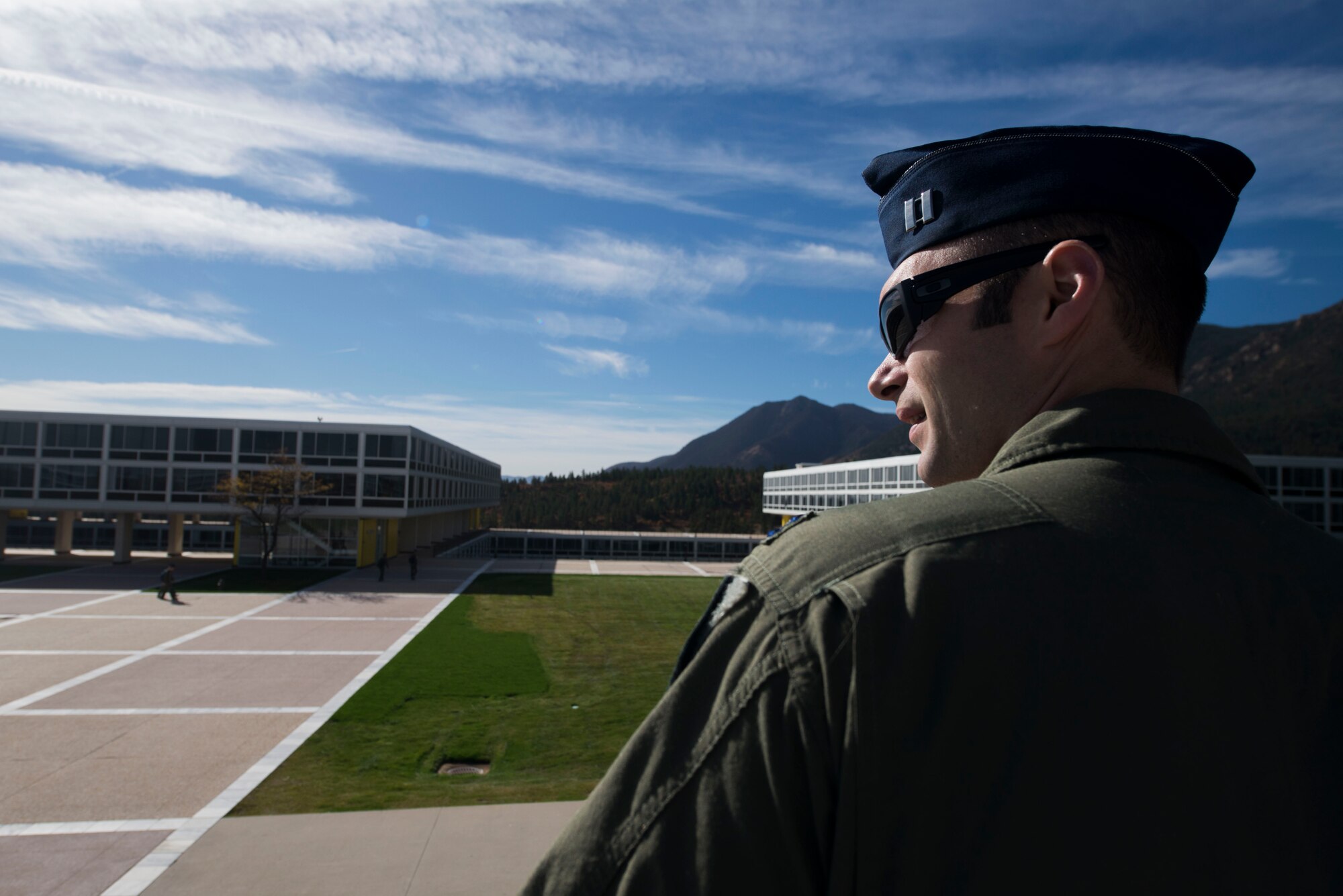 U.S. Air Force Capt. Keith Madsen, 75th Fighter Squadron A-10C Thunderbolt II pilot, looks across the cadet area during a campus tour Oct. 17, 2014, at the U.S. Air Force Academy, Colo. Madsen, a 2009 Academy graduate, revisited the campus for the first time since his graduation. (U.S. Air Force photo by Airman 1st Class Dillian Bamman/Released)