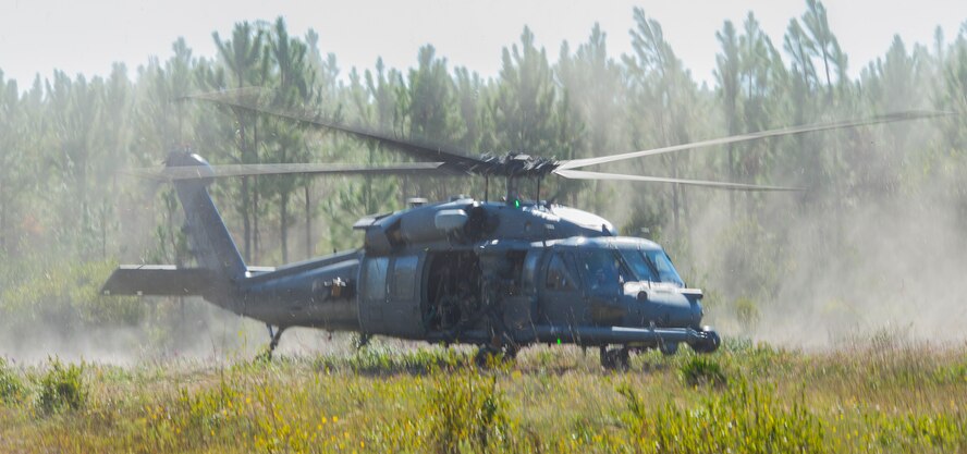 An HH-60G Pave Hawk lands during a combat search and rescue task force exercise Oct. 22, 2014, in Homerville, Ga. Members of the 75th Fighter Squadron and the 41st Rescue Squadron joined forces to provide close air support and to rescue a simulated aircraft crash survivor. (U.S. Air Force Airman 1st Class Ceaira Tinsley/Released)