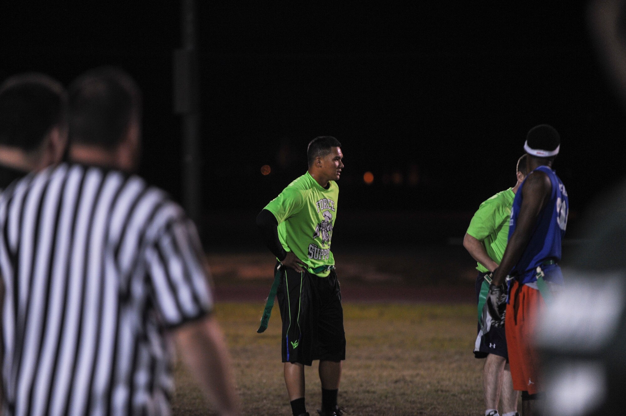 Fredrick Burgos, the 19th Force Support Squadron quarterback, looks on after throwing his second interception of the night Oct. 16, 2014, at Little Rock Air Force Base, Ark. Burgos and his FSS squad failed to find pay dirt in the 20-0 shutout. (U.S. Air Force photo by Airman 1st Class Cliffton Dolezal)
