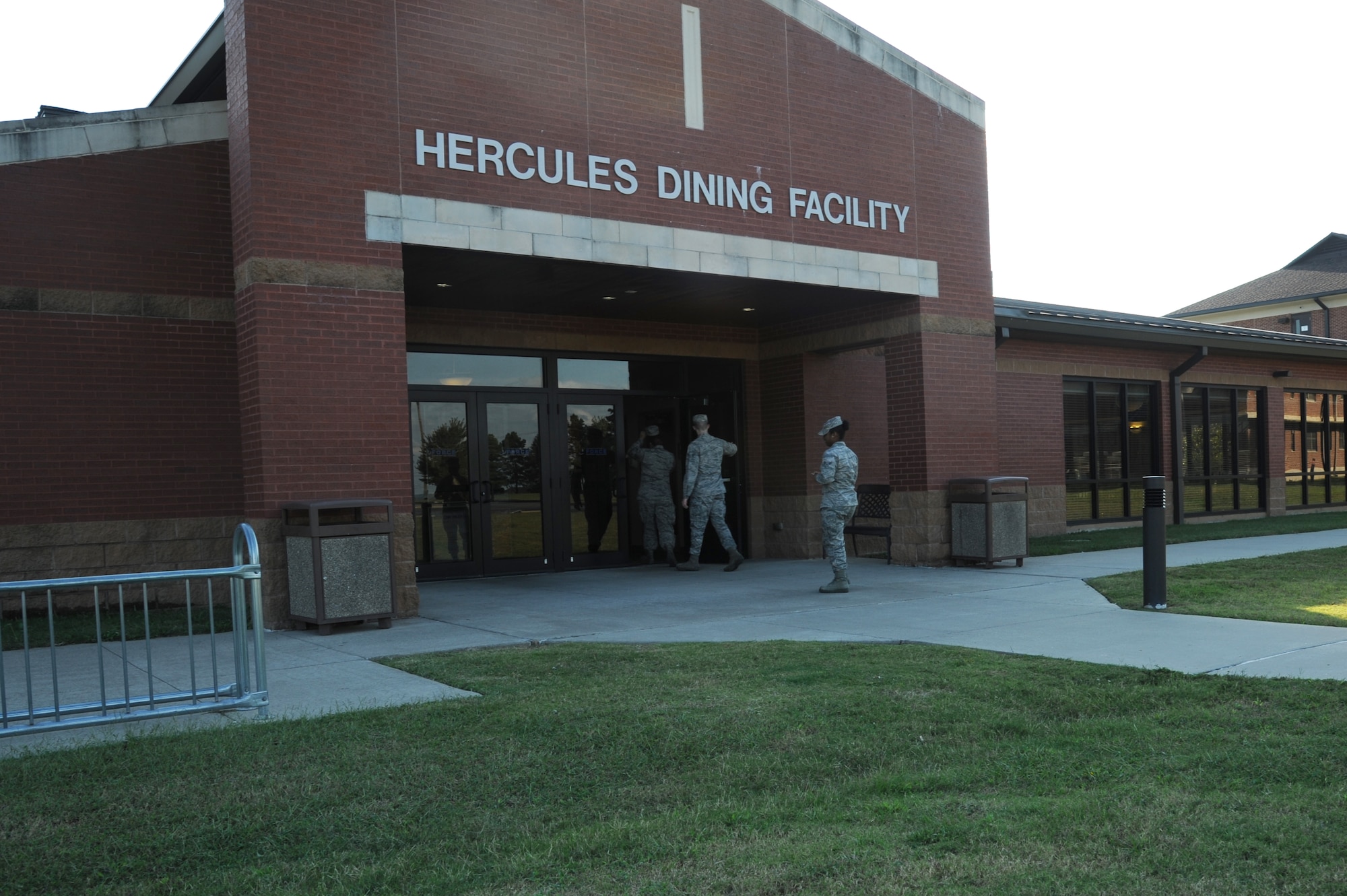 A group of Airmen walk into the Hercules Dining Facility Oct. 9, 2014, at Little Rock Air Force Base, Ark. The dining facility is open to all Airmen of Little Rock AFB. (U.S. Air Force photo by Airman 1st Class Mercedes Muro) 
