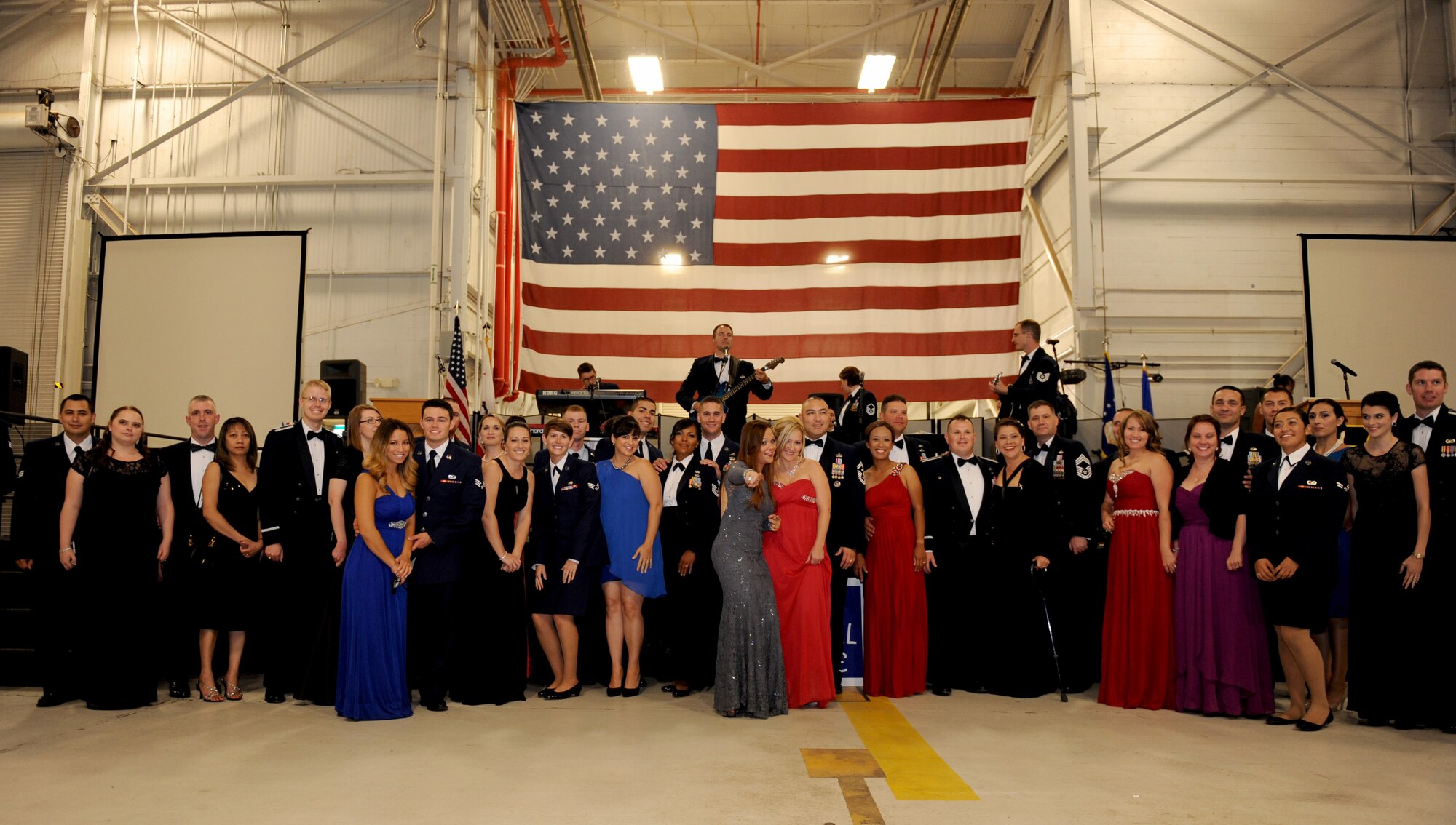 Members of Team Beale pose for a photo during Beale’s Air Force Ball held on Beale Air Force Base, Calif., Oct. 18, 2014. More than 500 guests attended the event, which featured live music from the U.S. Air Force Band of the Golden West, aircraft static displays, and a tribute to past Airmen. (U.S. Air Force photo by Staff Sgt. Robert M. Trujillo/Released)