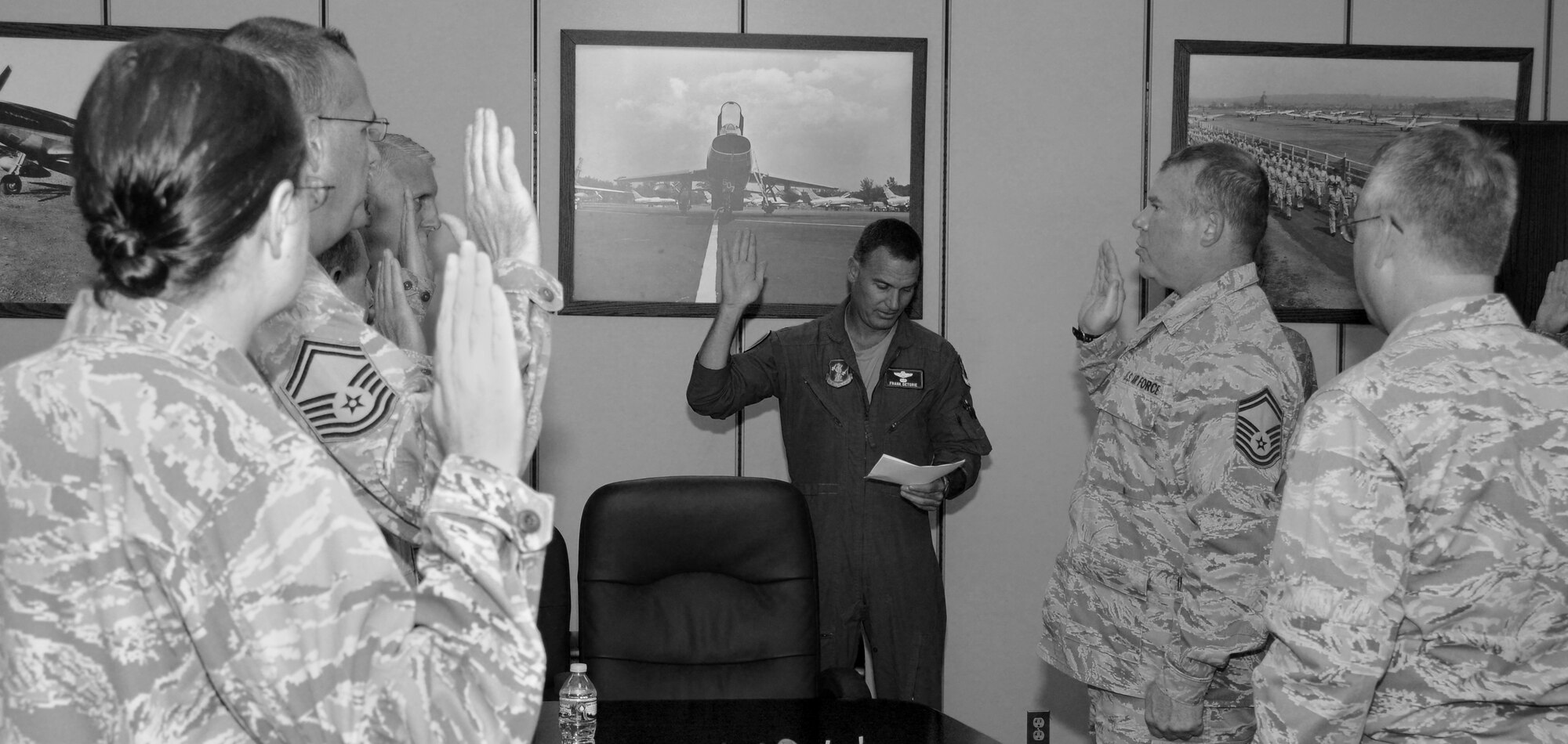 Col. Frank Detorie, commander of the 103rd Airlift Wing, administers the oath of responsibility to approximately 25 Airmen who are newly appointed members of the wing’s inspection team, at Bradley Air National Guard Base, East Granby, Conn., June 10, 2014.  The Airmen will replace the exercise evaluation team and will develop and evaluate exercises, track compliance and issues, and report to the commander.   (U.S. Air National Guard photo by Tech. Sgt. Joshua Mead)