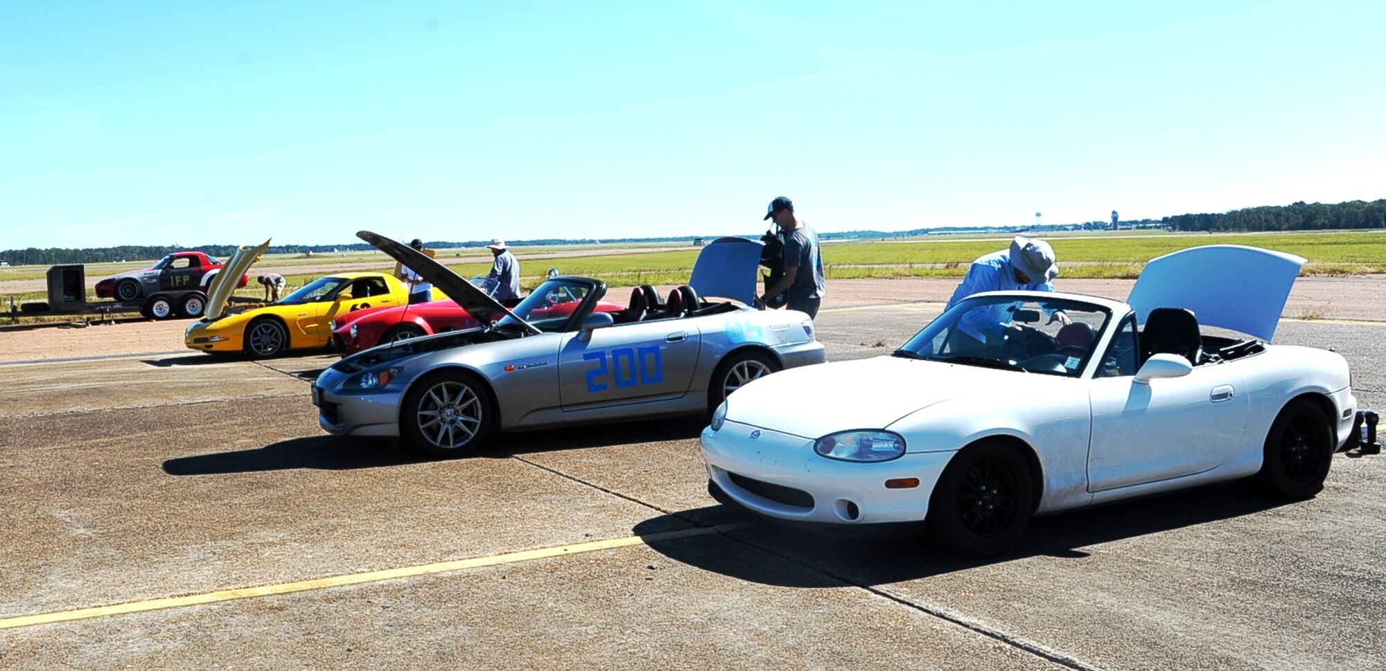 Autocross racers line up and prepare their vehicles for a timed race around a designated track Oct. 19 at the SAC ramp on Columbus Air Force Base. This was the last Autocross scheduled on base this year, however more are scheduled for the upcoming spring season. (U.S. Air Force photo/Airman Daniel Lile)