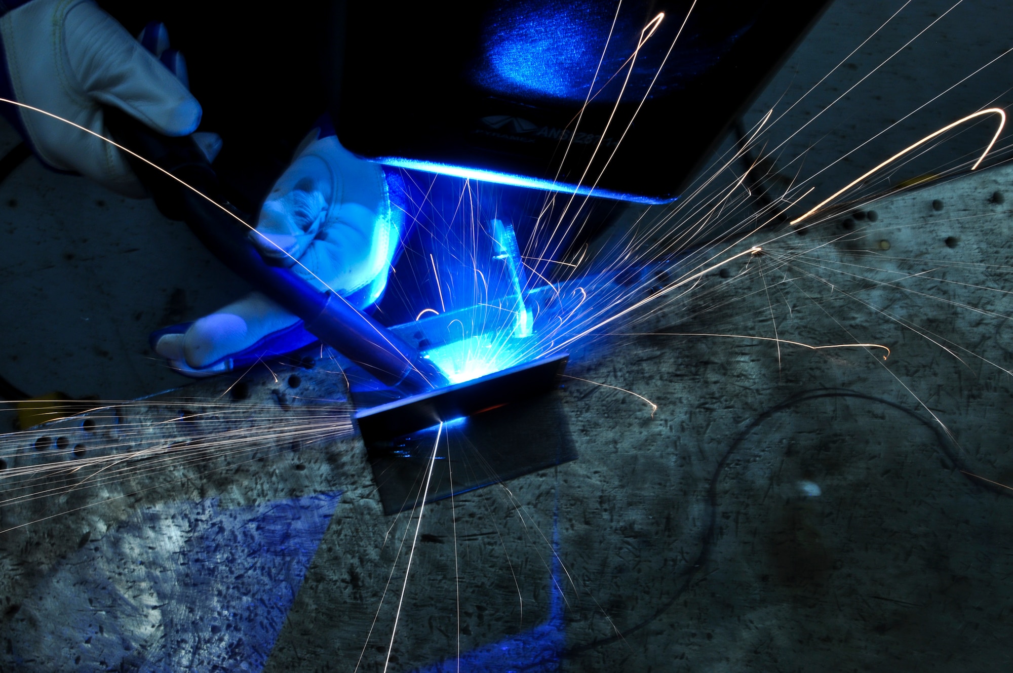 Airman 1st Class Brandon Kays, 911th Maintenance Squadron metals technology specialist, mig welds a T-joint for training at the Pittsburgh International Airport Air Reserve Station, Oct. 4, 2014. Metals technology specialists fabricate metal parts for various projects, including parts for the aircraft and aircraft ground equipment. (U.S. Air Force photo by Senior Airman Joshua J. Seybert)