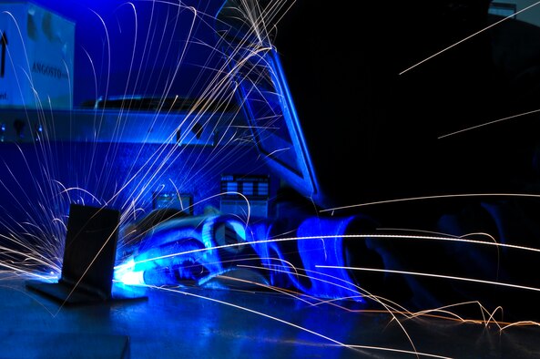 Airman 1st Class Brandon Kays, 911th Maintenance Squadron metals technology specialist, mig welds a T-joint for training at the Pittsburgh International Airport Air Reserve Station, Oct. 4, 2014. Metals technology specialists must mig weld once every six months to comply with training standards. (U.S. Air Force photo by Senior Airman Joshua J. Seybert)