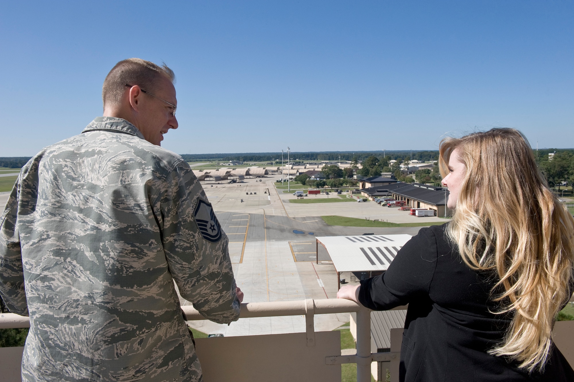 Master Sgt. Roy Johnson, 4th Operations Support Squadron, gives Jaime Thompson, U.S. Navy Lt. Seymour Johnson’s great-granddaughter, a view of the flightline from the air traffic control tower during a tour of Seymour Johnson Air Force Base, North Carolina, Oct. 17, 2014. Thompson visited several units on base including the air traffic control tower and the 4th Security Forces Squadron military working dogs. She was also able to get up close and personal with the cockpit of an F-15E Strike Eagle. (U.S. Air Force photo/Airman 1st Class Aaron Jenne)