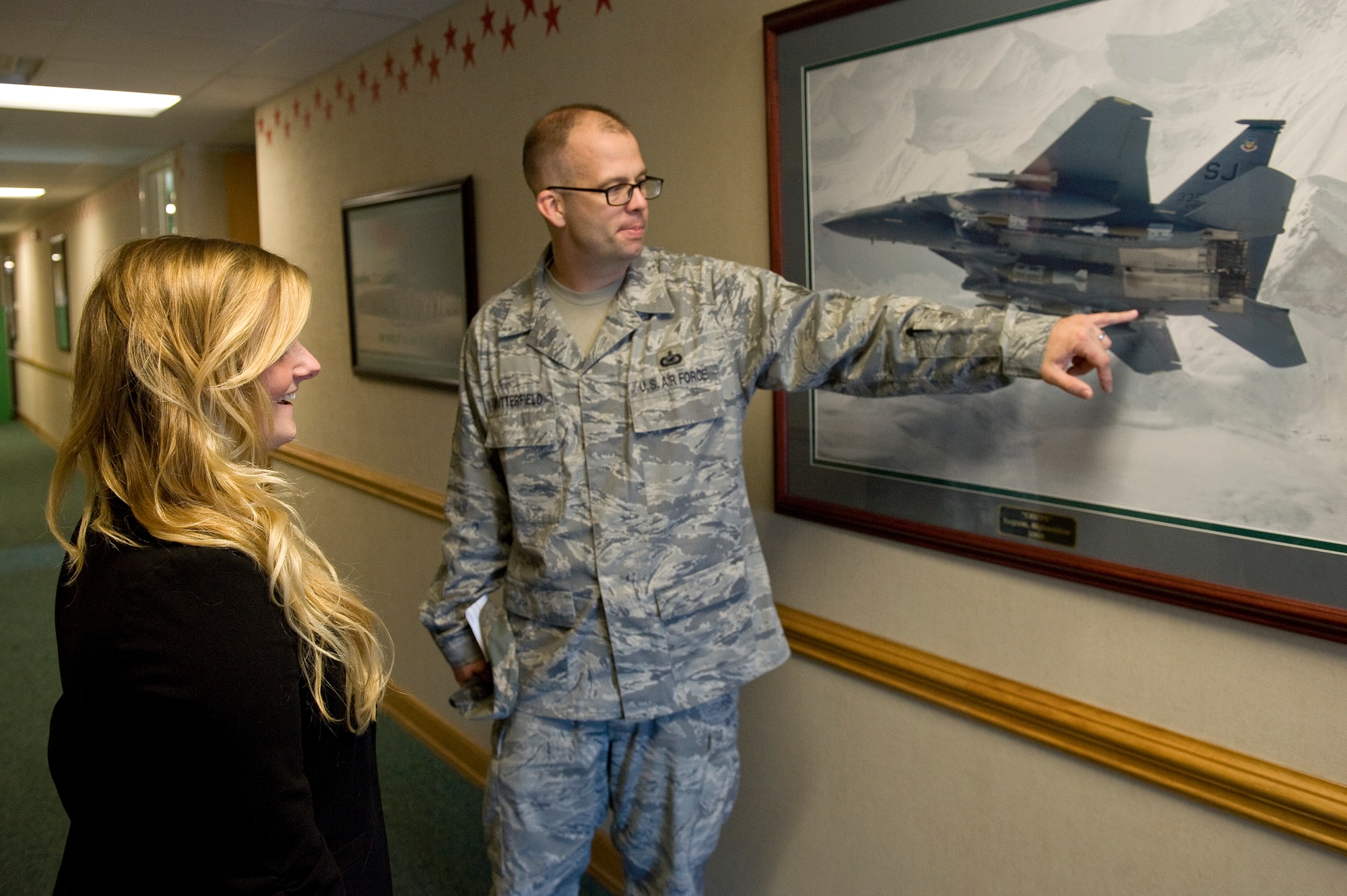 Tech. Sgt. Phillip Butterfield, 4th Fighter Wing Public Affairs, gives Jaime Thompson, U.S. Navy Lt. Seymour Johnson’s great-granddaughter, a tour of Seymour Johnson Air Force Base, North Carolina, Oct. 17, 2014, wherein she familiarized herself with Seymour Johnson’s history; both the man and the base. Thompson visited several units on base including the air traffic control tower and the 4th Security Forces Squadron military working dogs. She was also able to get up close and personal with the cockpit of an F-15E Strike Eagle. (U.S. Air Force photo/Airman 1st Class Aaron Jenne)