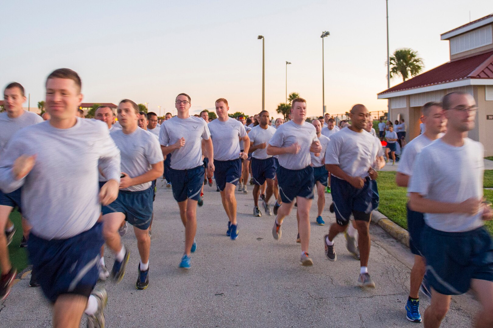 Members of the 45th Space Wing participate in an early run to kick off Wingman Day at Patrick Air Force Base, Fla., Oct. 17, 2014. Participants selected theme-based, university campus-style classes designed to encourage and encompass the Comprehensive Airmen Fitness resilience domains; which are physical, social, mental and spiritual. (U.S. Air Force photo/Matthew Jurgens) (Released) 