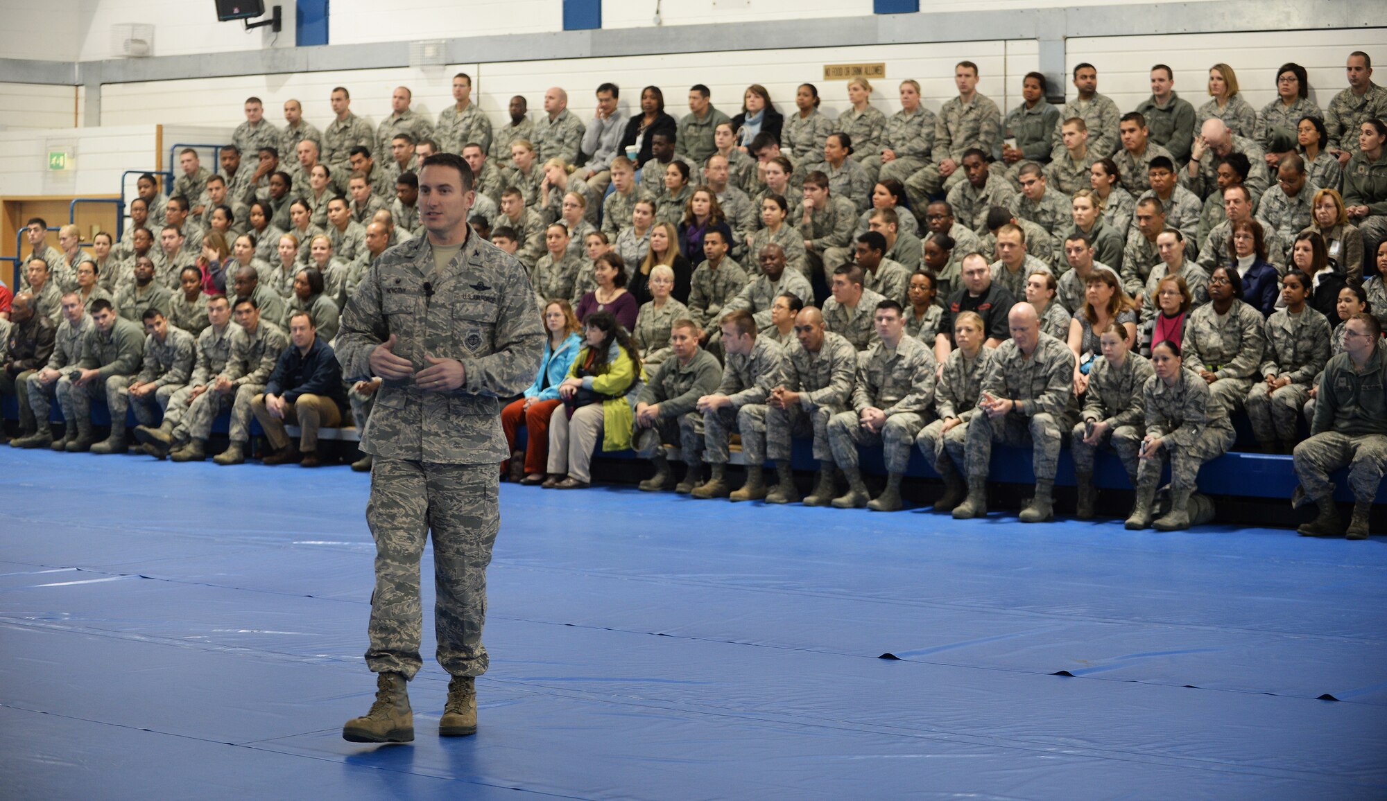 Col. Robert Novotny, 48th Fighter Wing commander, addresses Liberty Wing Airmen during a commander’s call at Royal Air Force Lakenheath, England. Novotny emphasized the importance of 48th FW Airmen’s contributions to U.S. Air Forces in Europe. (U.S. Air Force photo by Staff Sgt. Emerson Nuñez/Released)   