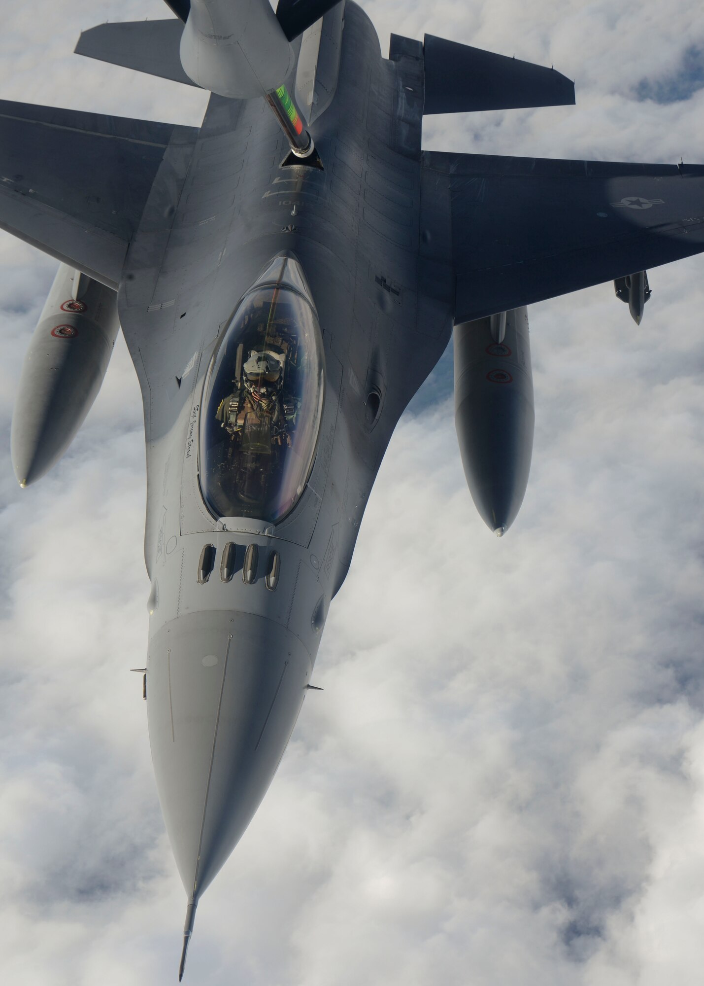 A U.S. Air Force F-16 Fighting Falcon from Spangdahlem Air Base, Germany, prepares to take fuel from a KC-135 Stratotanker assigned to RAF Mildenhall, England, after receiving fuel during the NATO-led exercise Noble Justification Oct. 21, 2014, hosted by Istres Air Base, France. The exercise involves more than 13,000 service members and takes place across Europe and the Mediterranean. NATO regularly exercises to maintain readiness and to provide the early establishment of NATO military presence. (U.S. Air Force photo/Senior Airman Victoria H. Taylor/Released)