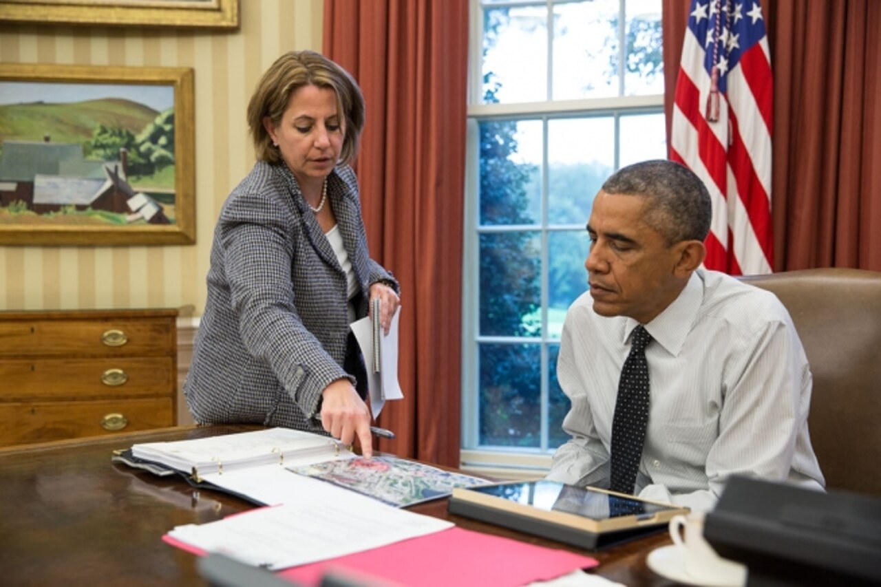 Lisa Monaco, assistant to the president for homeland security and counterterrorism, updates President Barack Obama in the Oval Office on the shooting in Canada prior to his phone call with Prime Minister Stephen Harper, Oct. 22, 2014. White House Photo by Pete Souza