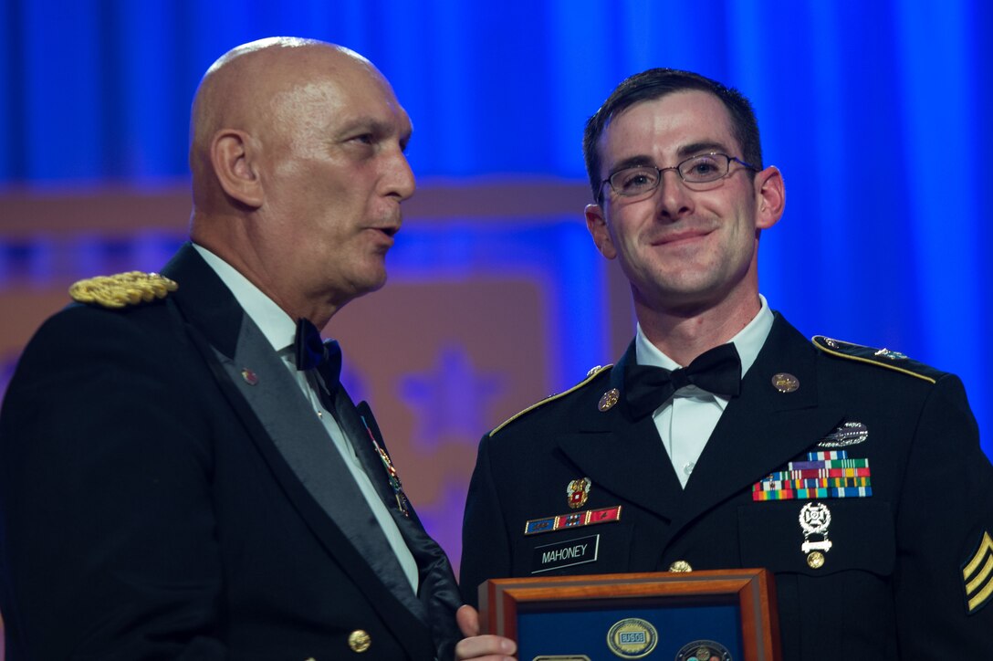 Army Chief of Staff Gen. Ray T. Odierno, left, congratulates Army Sgt. Andrew J. Mahoney at the 2014 USO Gala in Washington, D.C., Oct. 17, 2014.  
