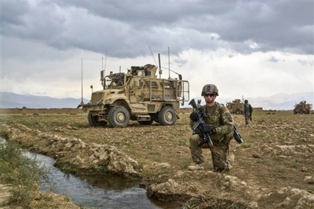 U.S. Army Spc. Michael Berna counts personnel after a patrol through the village of Kali Nasra in eastern Afghanistan, Oct. 13, 2014. Berna is a cavalry scout assigned to the 101st Airborne Division's 1st Squadron, 75th Cavalry Regiment, 2nd Brigade Combat Team Brigade. 
